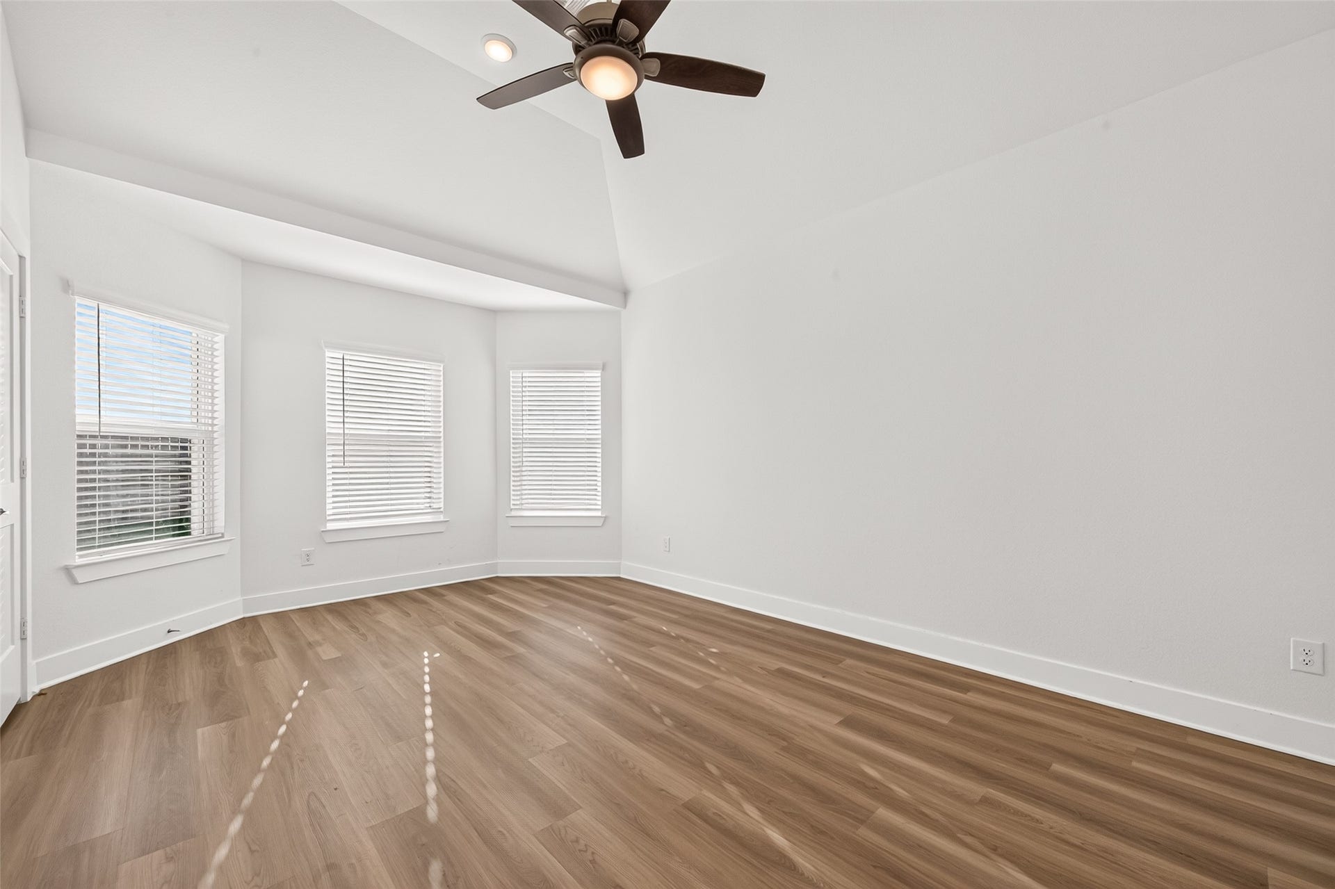 2002 Flatland Drive, Rosenberg, TX 77471 Primary bedroom bay window with three windows bringing in natural light.