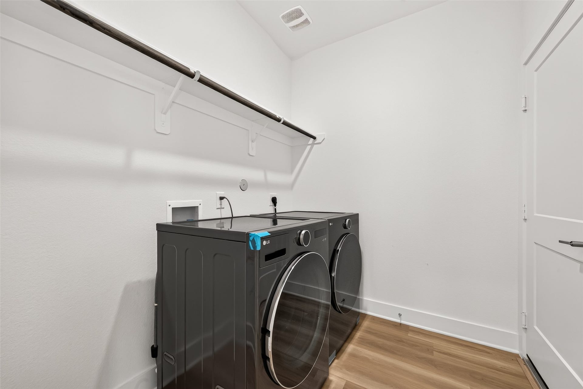 2002 Flatland Drive, Rosenberg, TX 77471 Utility room with shelving, hanging rod, and space. Washer and dryer included.