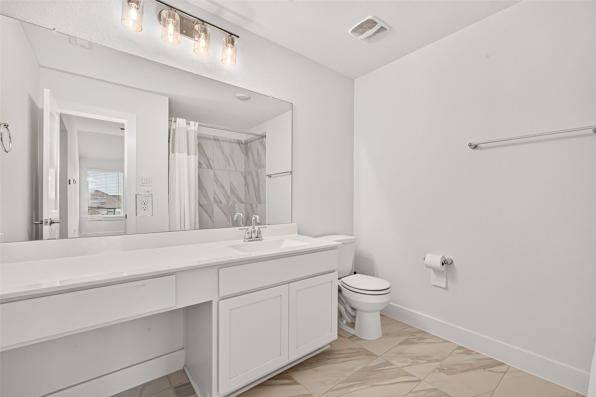 2002 Flatland Drive, Rosenberg, TX 77471 Secondary bathroom with extended vanity, storage drawers, and tub/shower combination.