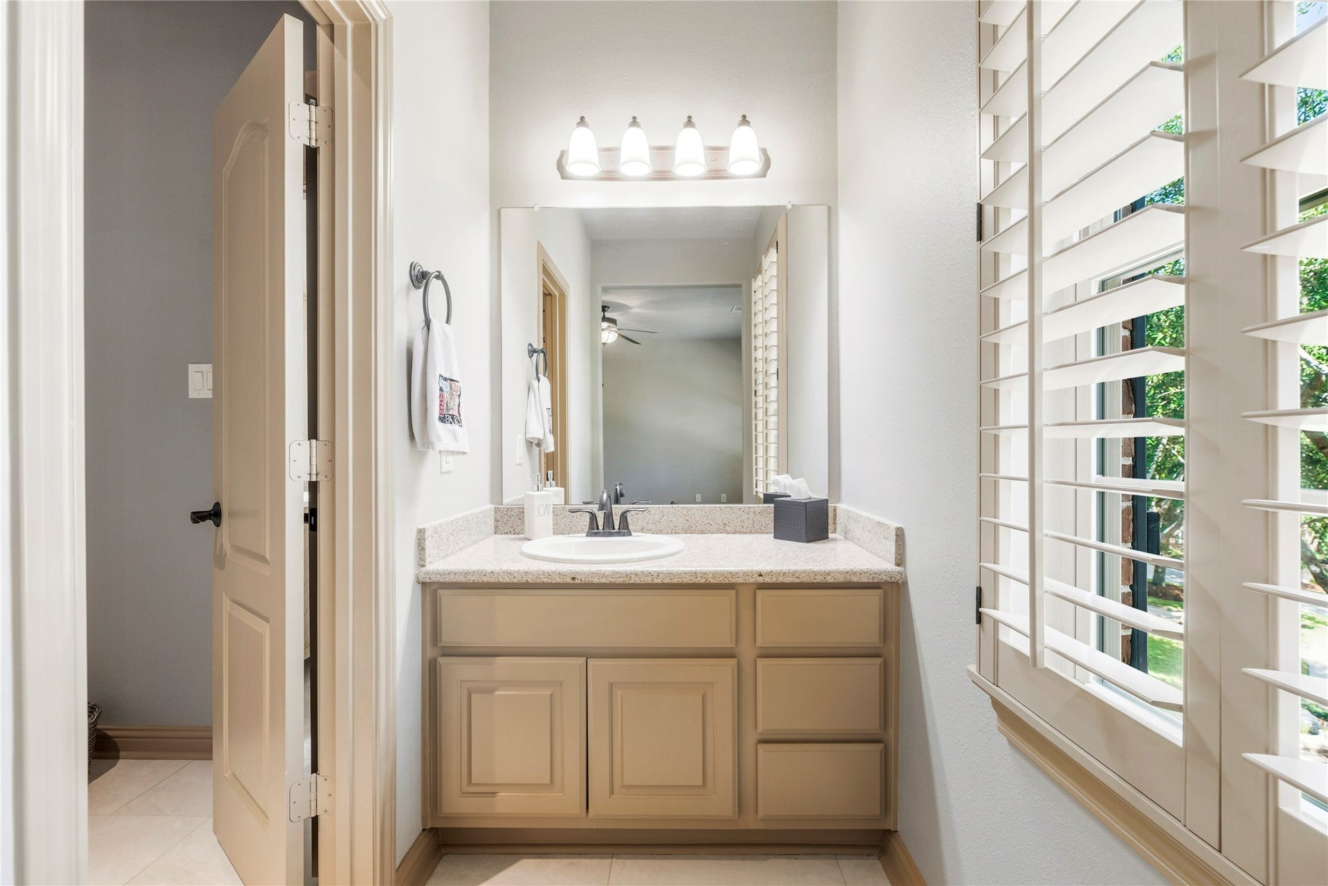 12002 Tall Haven Lane, Cypress, TX 77433 Bright bathroom vanity area featuring a large , and natural light.