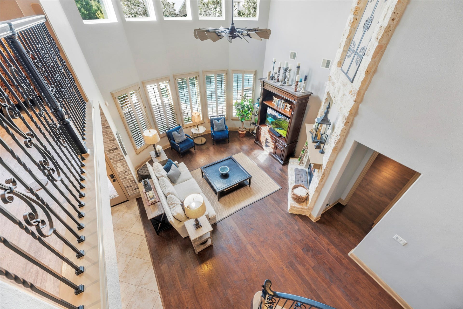 12002 Tall Haven Lane, Cypress, TX 77433 Beautiful overhead view of the living room, showcasing the soaring ceilings, open layout, and impressive architectural details.
