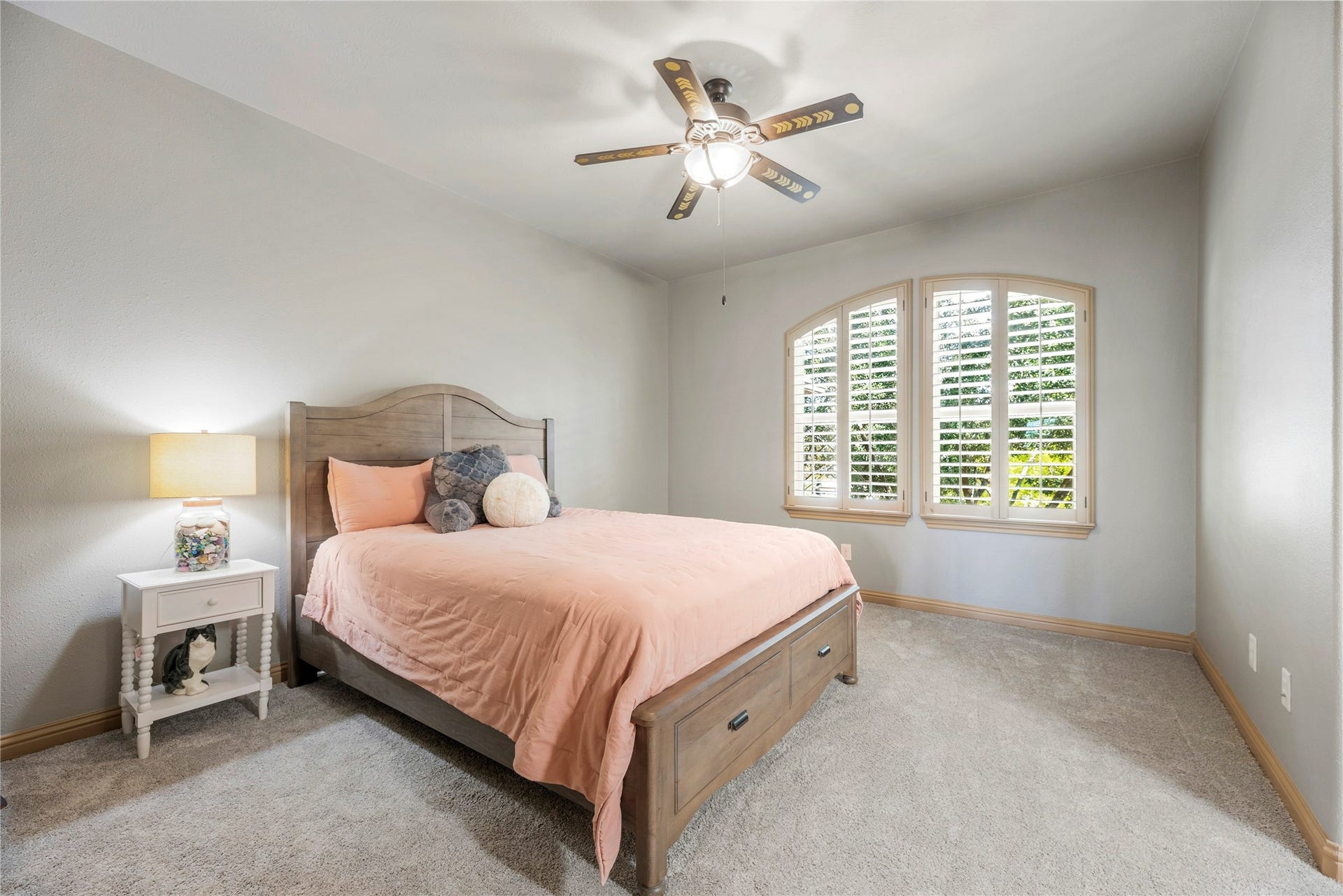 12002 Tall Haven Lane, Cypress, TX 77433 Upstairs bedroom featuring a jack and jill bath and windows overlooking the front outdoors.