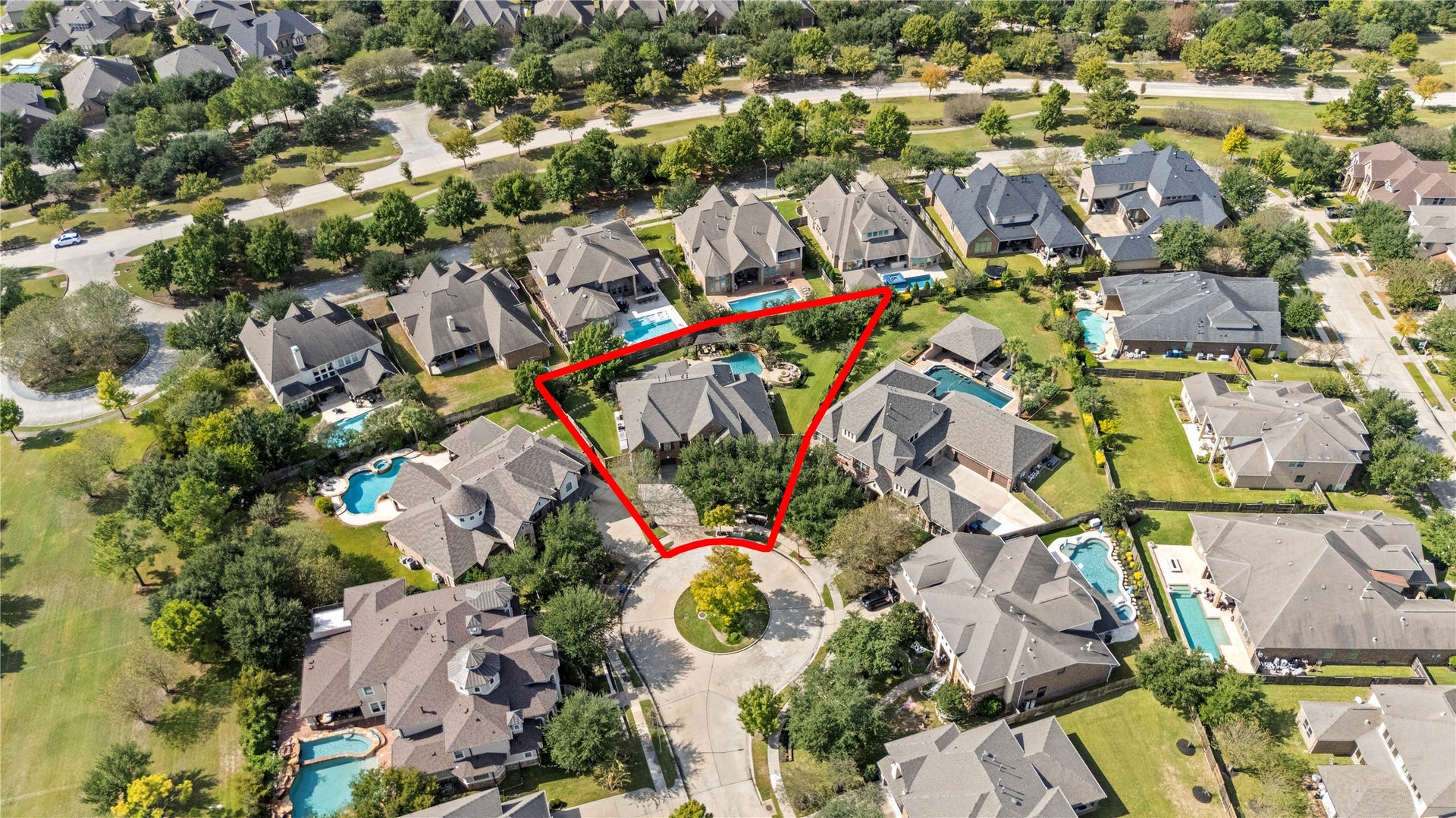 12002 Tall Haven Lane, Cypress, TX 77433 Aerial view showcasing the homes location within a beautiful neighborhood surrounded by mature trees.