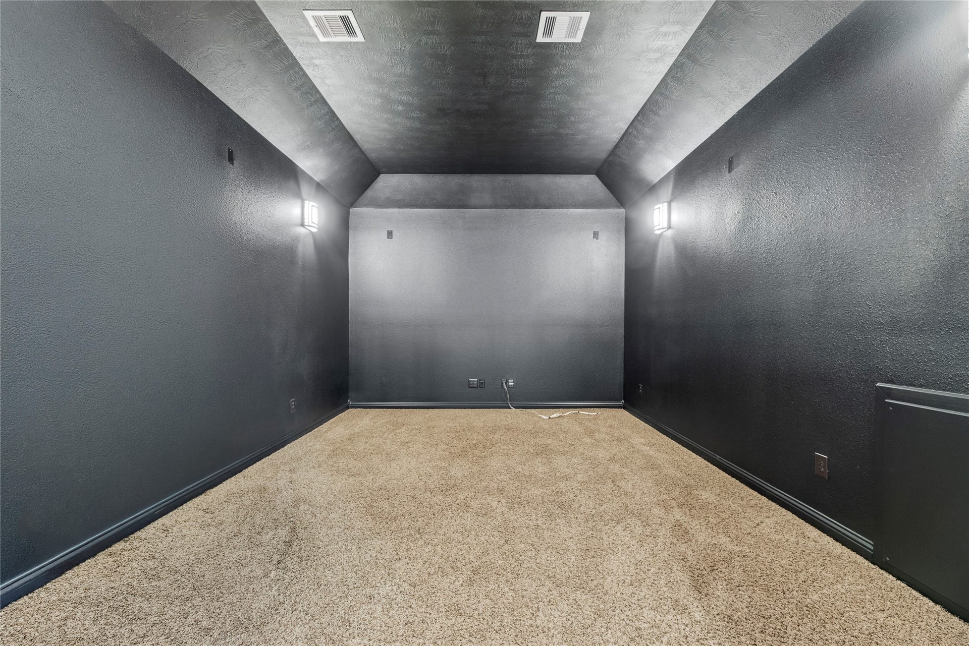 12002 Tall Haven Lane, Cypress, TX 77433 Dedicated media room with dark walls offering the perfect setting for movie nights and entertainment.