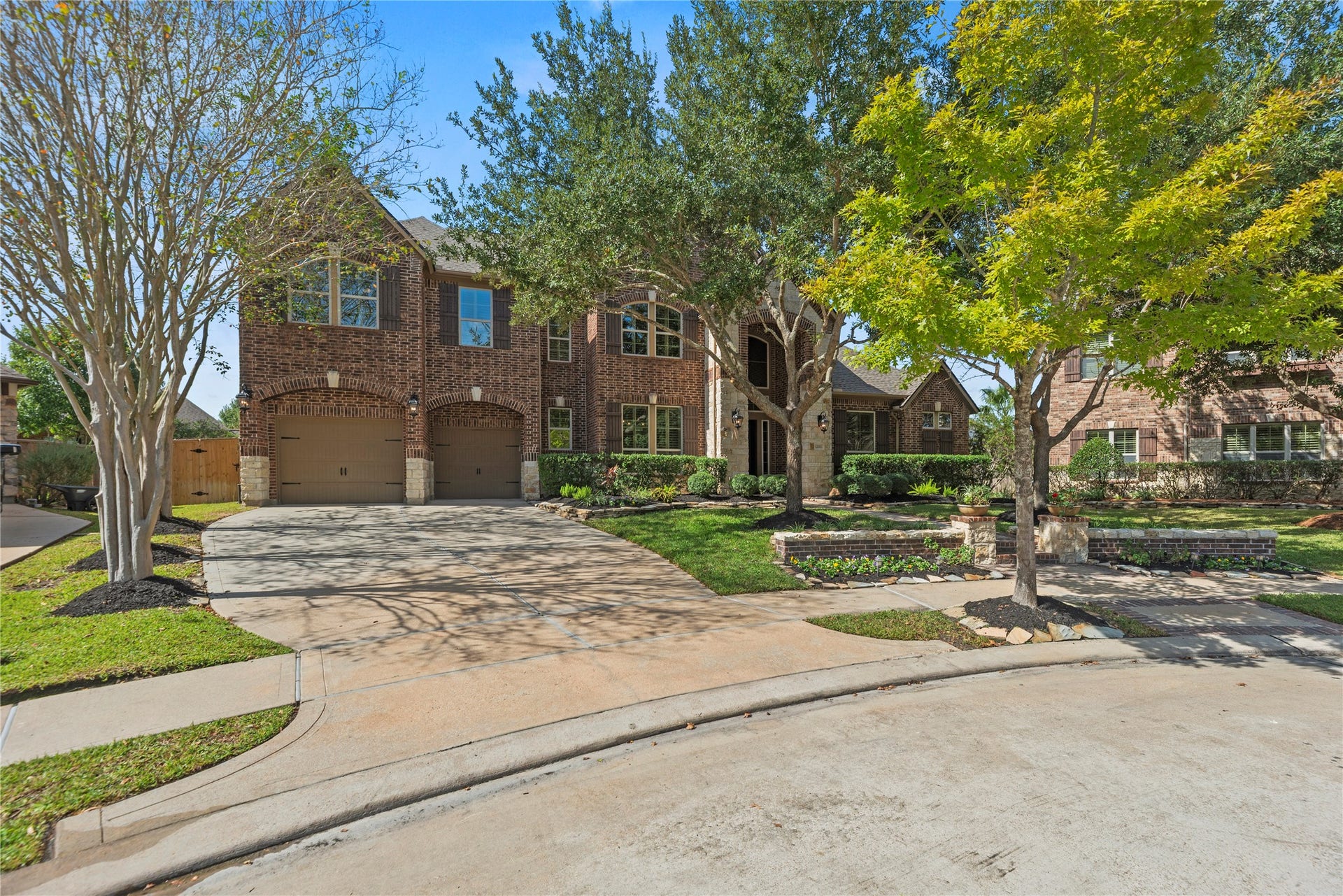 12002 Tall Haven Lane, Cypress, TX 77433 Beautiful two-story brick home in a cul-de-sac with a spacious driveway, and inviting curb appeal.