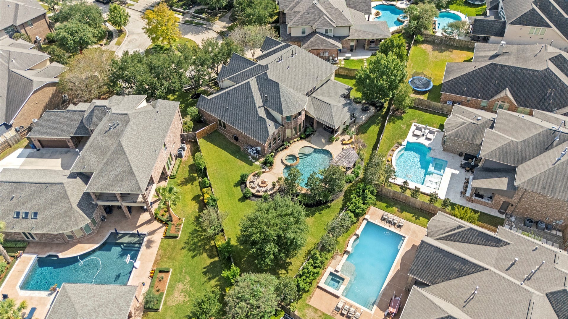 12002 Tall Haven Lane, Cypress, TX 77433 Surrounding neighborhood, showcasing the spacious properties and beautiful backyard settings.