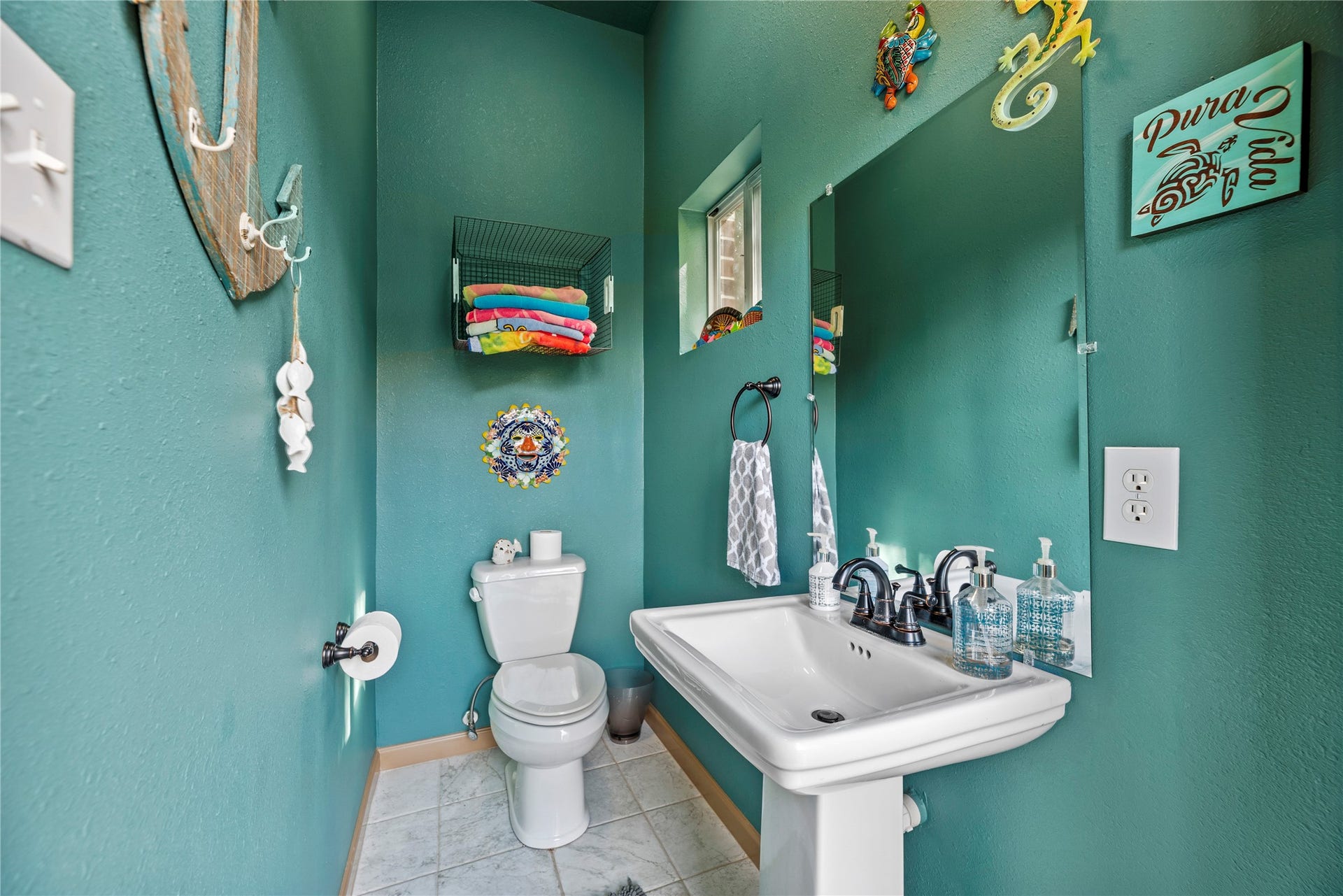 12002 Tall Haven Lane, Cypress, TX 77433 Convenient pool bathroom featuring rich green walls, a pedestal sink, and easy access for guests to enjoy the outdoor pool area.
