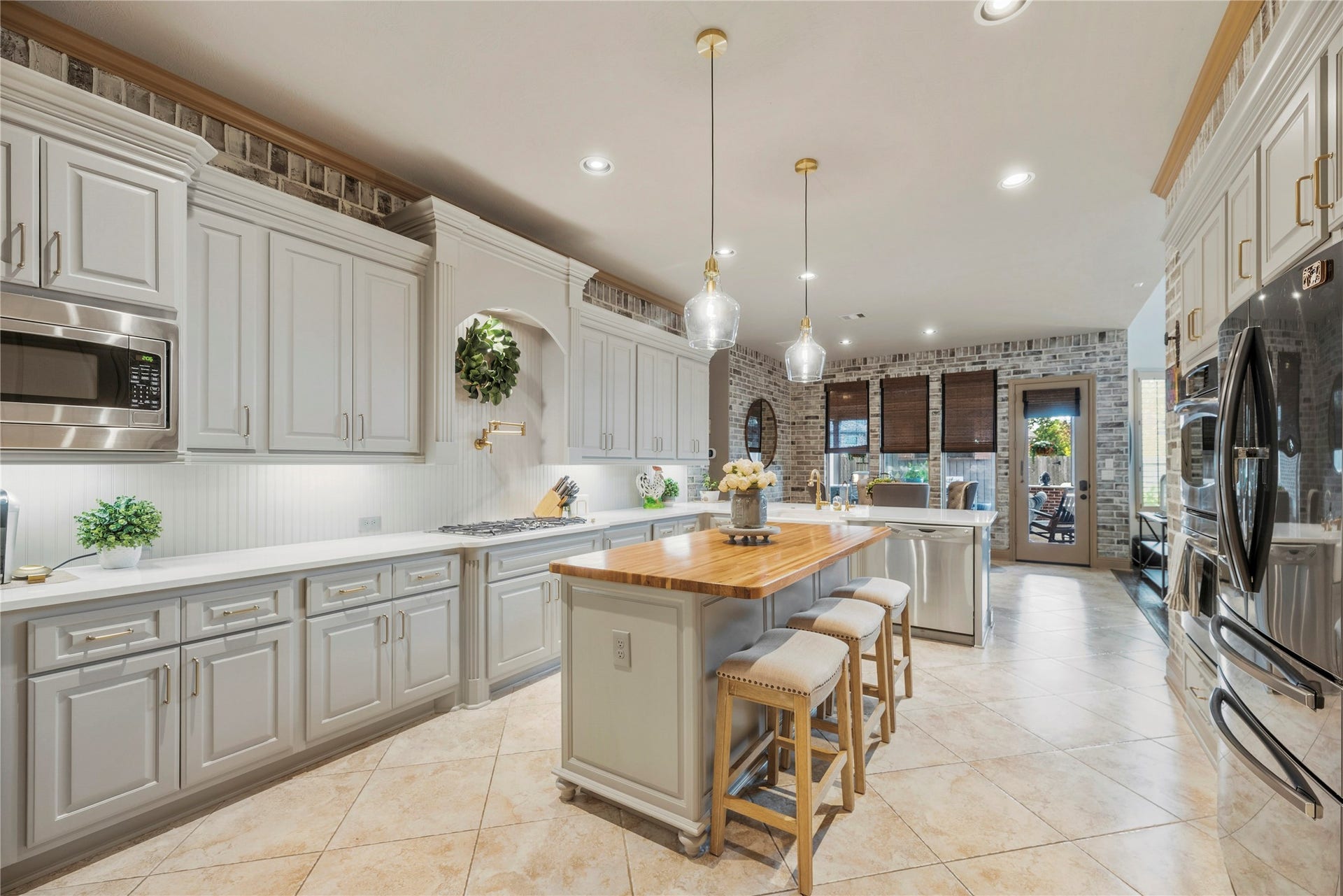 12002 Tall Haven Lane, Cypress, TX 77433 Bright kitchen featuring a spacious island and plenty of room for meal preparation.