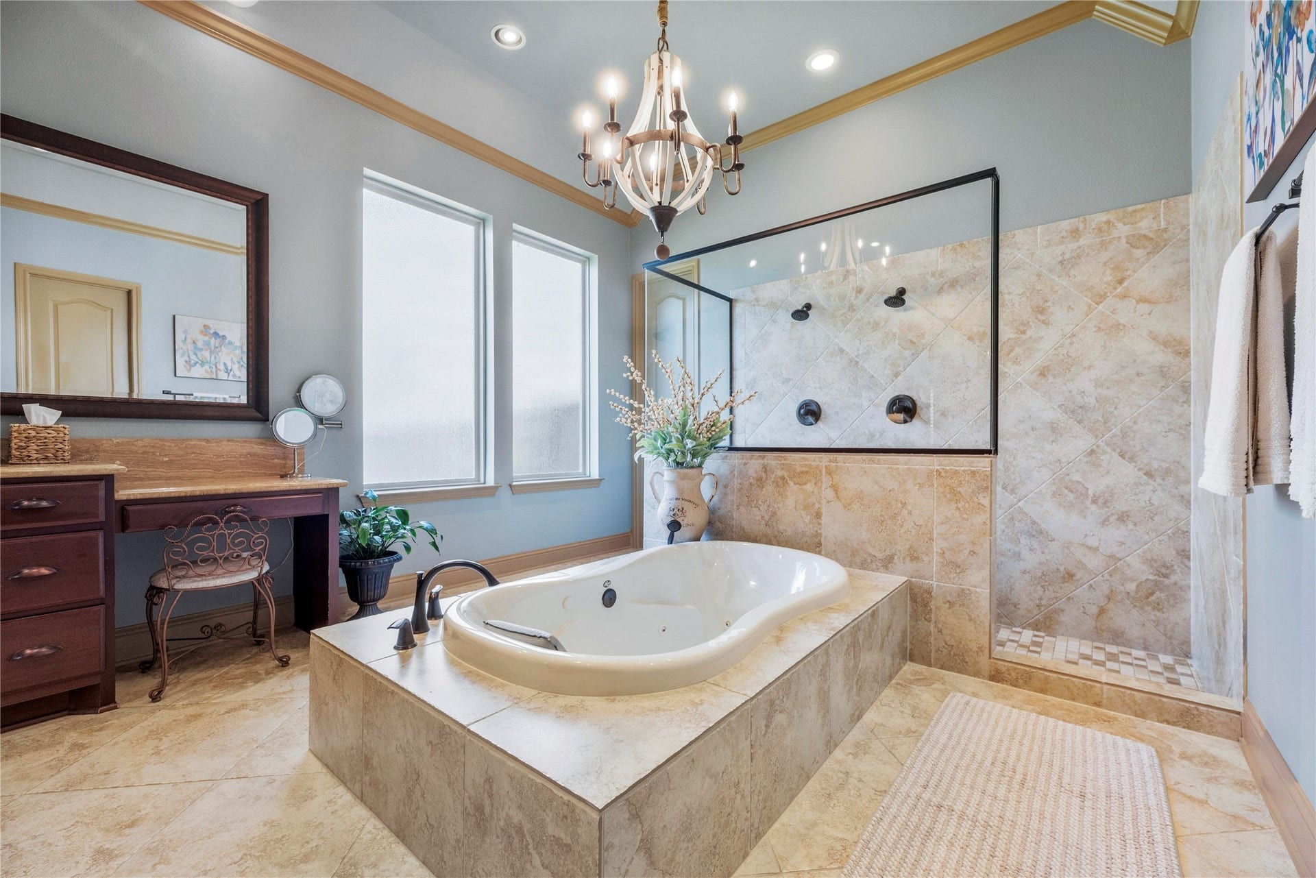 12002 Tall Haven Lane, Cypress, TX 77433 Another angle of the primary bathroom, highlighting the soaking tub, spacious vanities, and beautiful natural light.