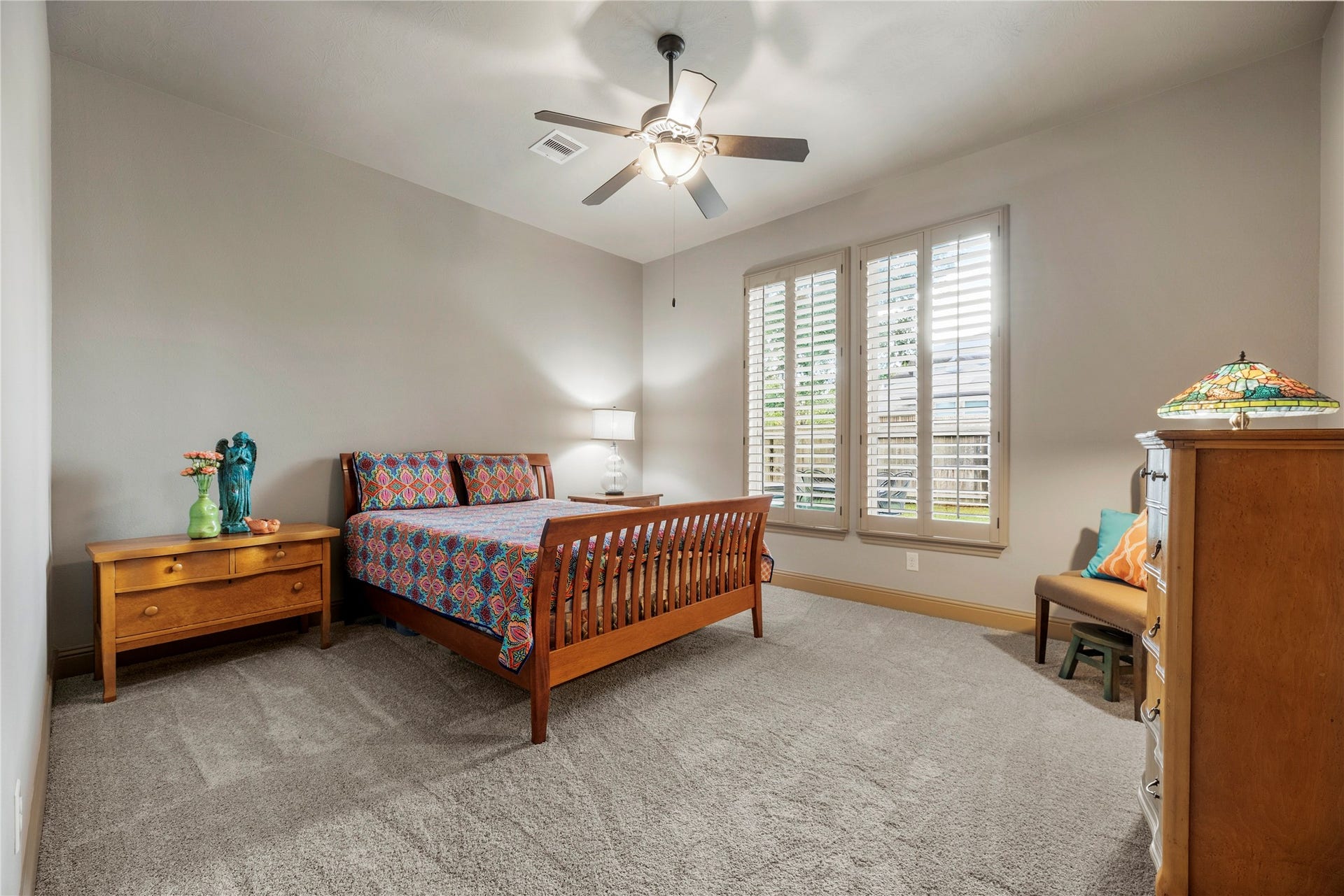 12002 Tall Haven Lane, Cypress, TX 77433 Bedroom 2 downstairs. Its a generous size featuring a ceiling fan and a large closet.
