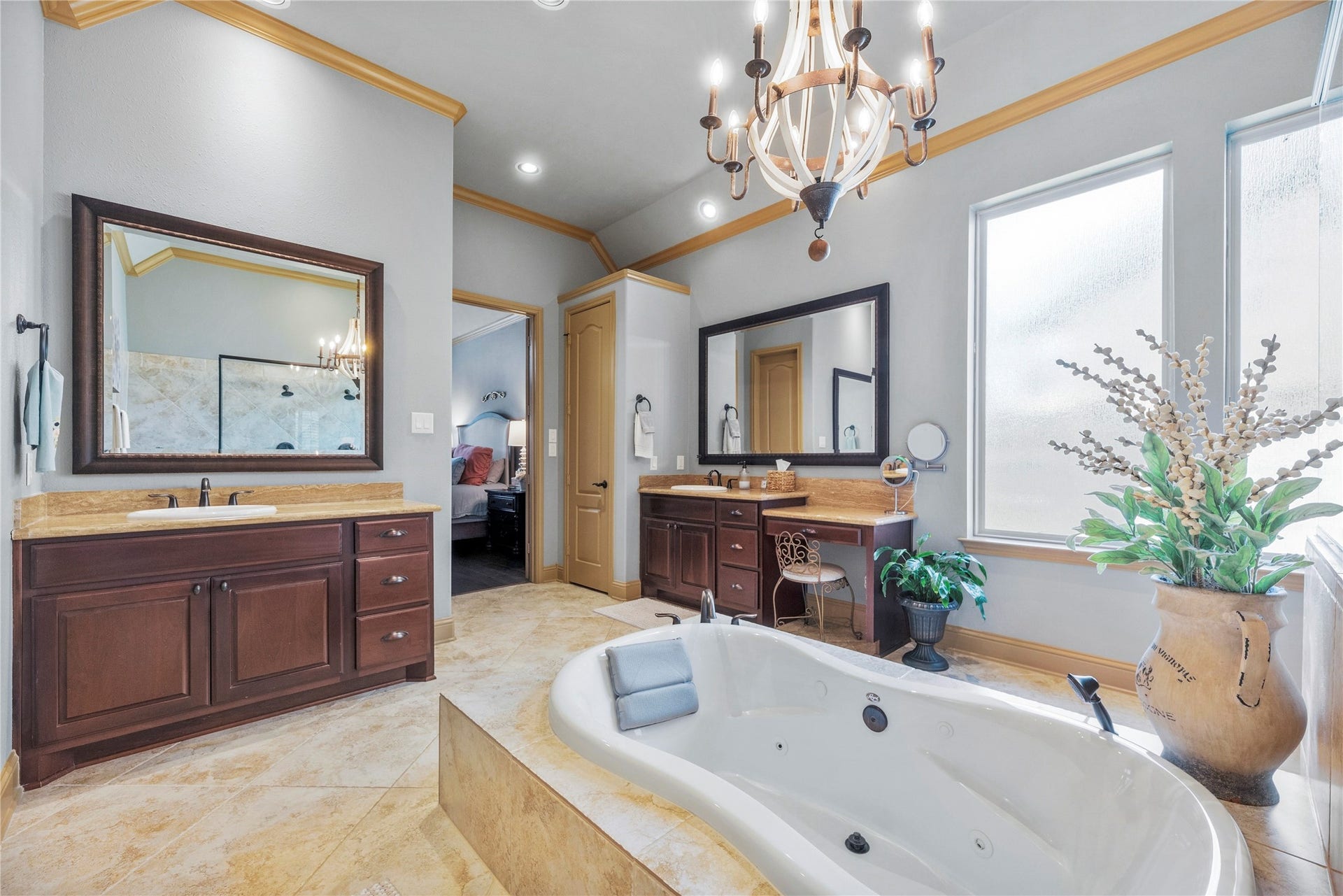 12002 Tall Haven Lane, Cypress, TX 77433 Elegant primary bathroom with a relaxing soaking tub, and generous counter space.