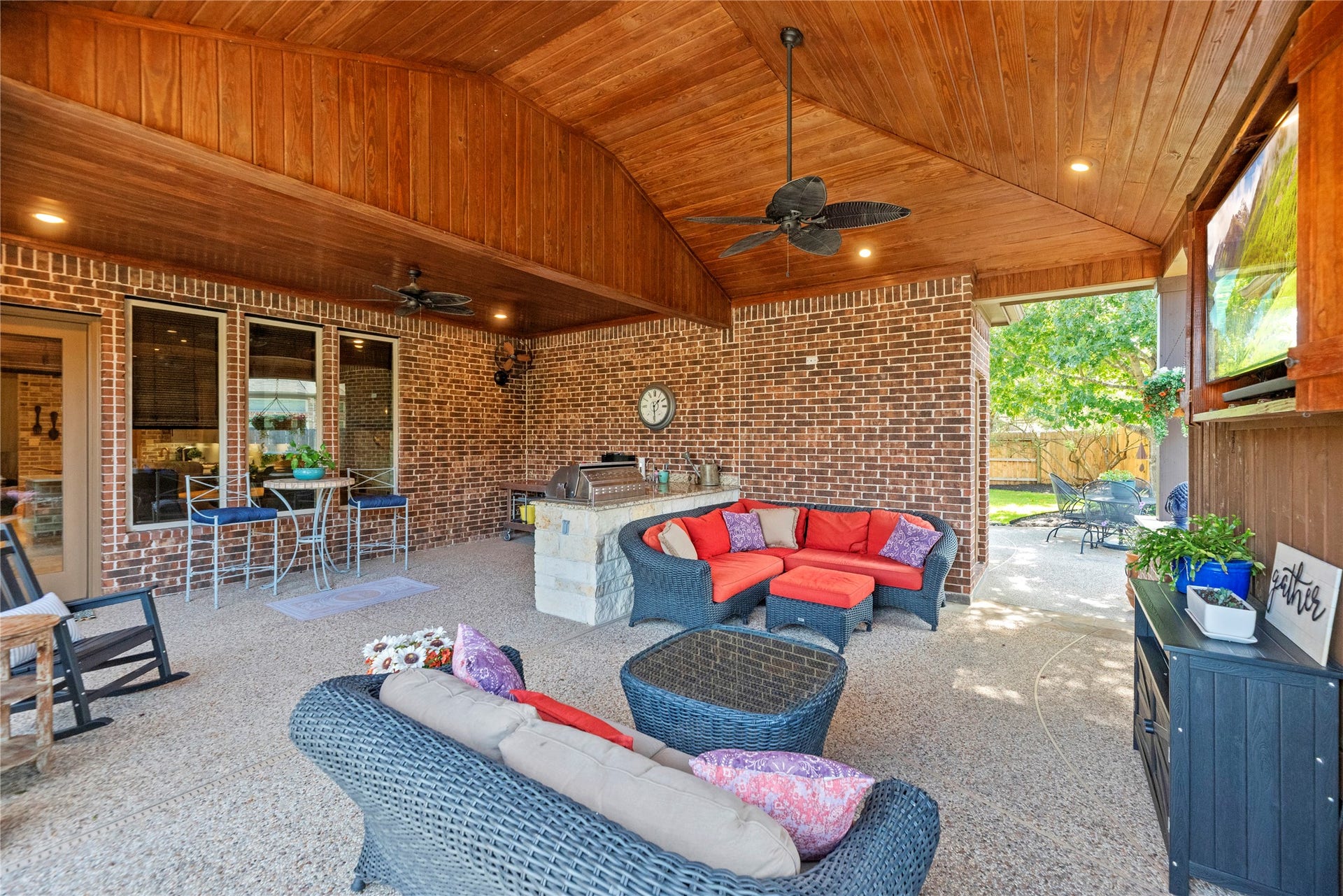 12002 Tall Haven Lane, Cypress, TX 77433 Another view of the covered patio, highlighting the generous seating space and inviting outdoor atmosphere.