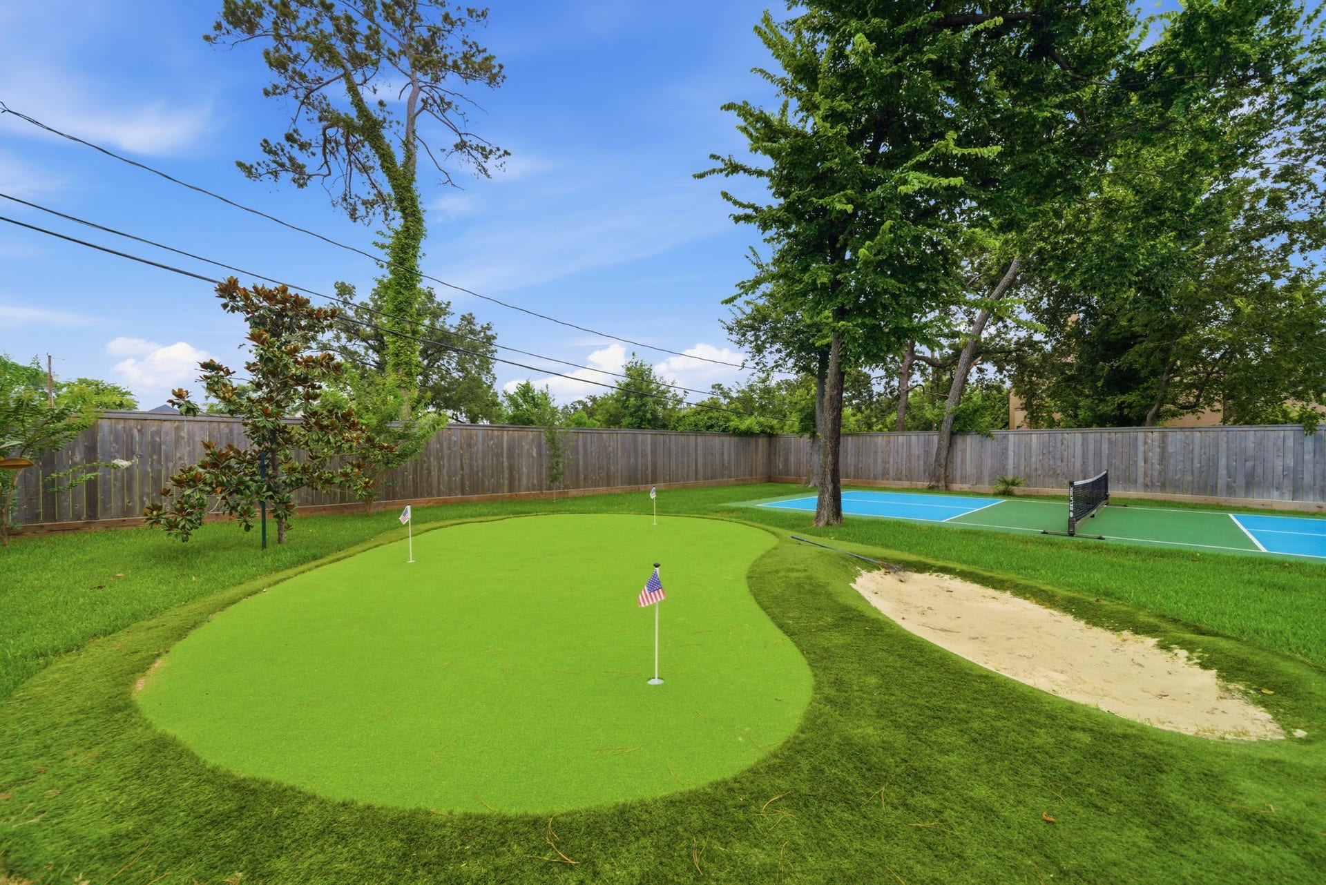 1510 Whispering Pines Drive, Houston, TX 77055 Putting green and sand trap.
