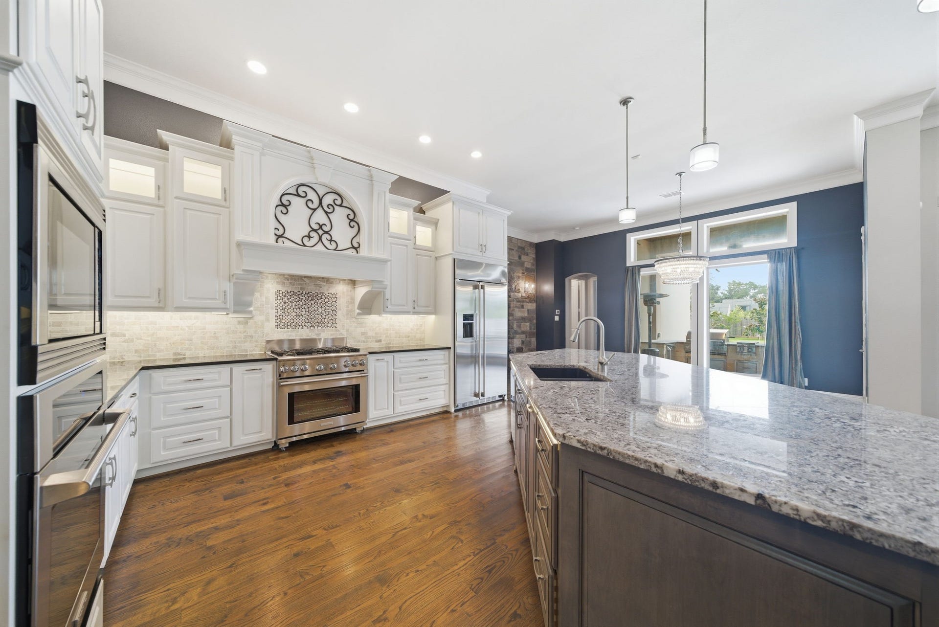 1510 Whispering Pines Drive, Houston, TX 77055 Kitchen is a chefs dram with gas range, 2 ovens, lots of cabinet. Views to the backyard!