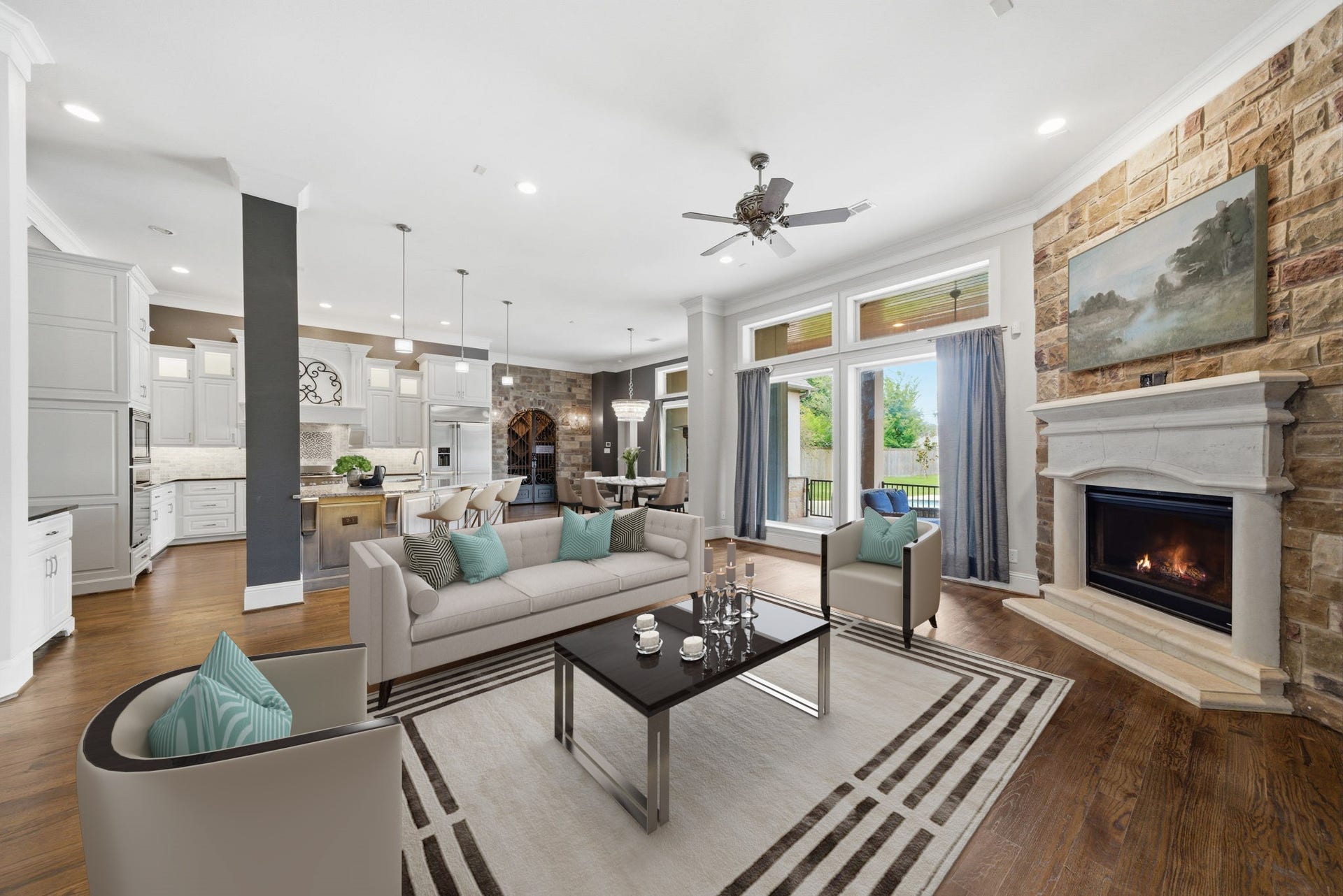 1510 Whispering Pines Drive, Houston, TX 77055 Open concept living area with gas log fireplace. Lovely views to the patio and backyard. Virtually staged.