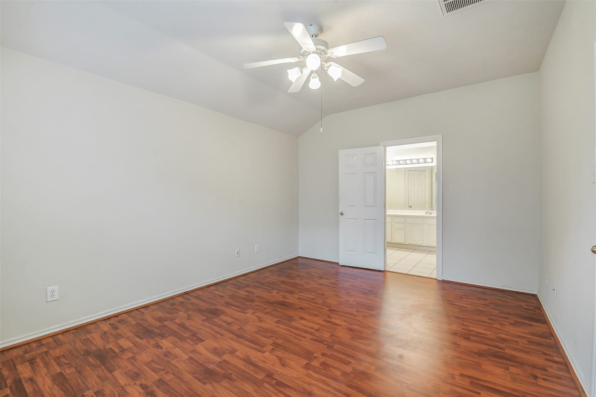 12115 Lucky Meadow Dr, Tomball, TX 77375 Spacious primary bedroom thoughtfully separated from the secondary bedrooms, offering added privacy, comfort, and tranquility.