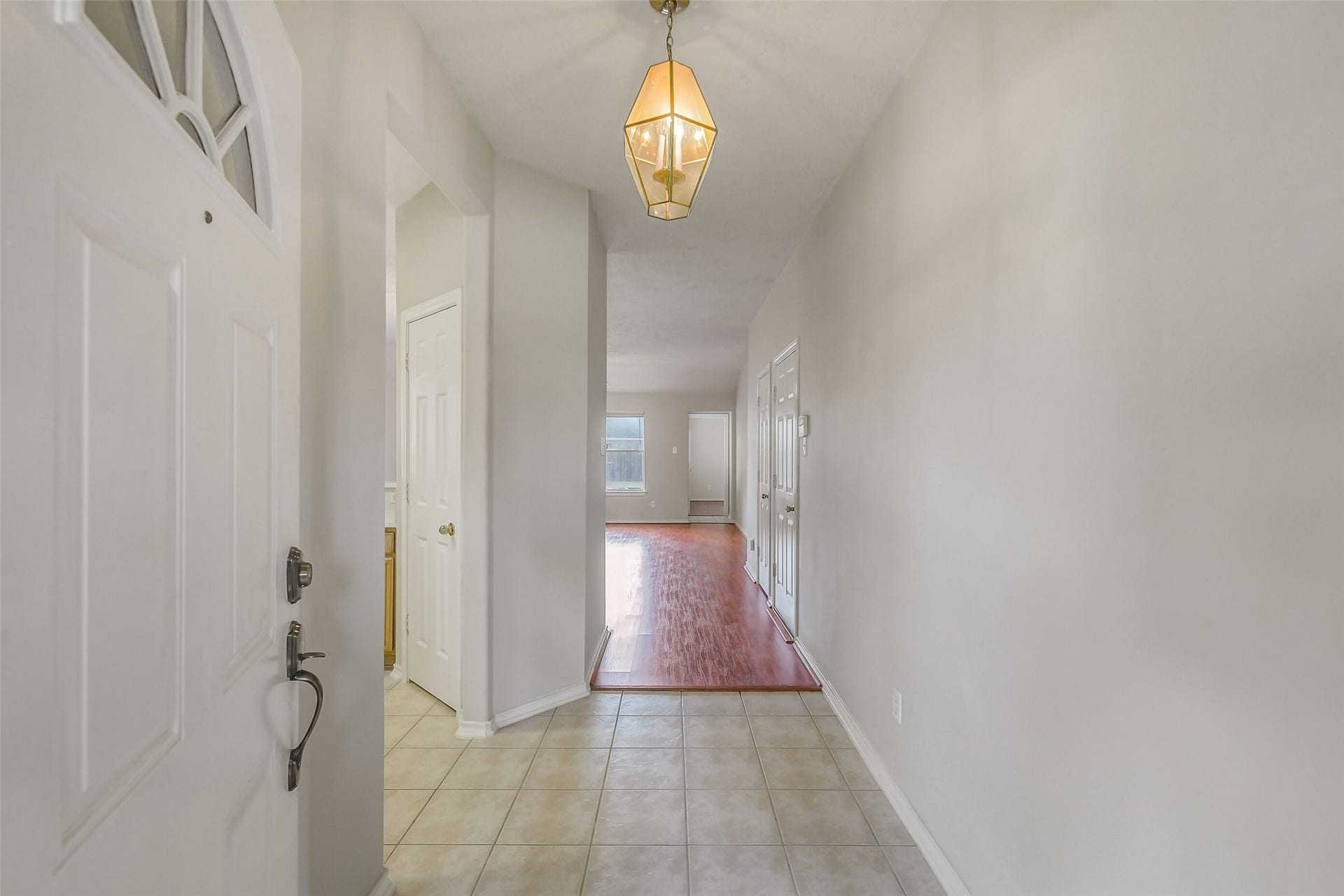 12115 Lucky Meadow Dr, Tomball, TX 77375 A welcoming foyer creates a smooth transition into the kitchen and spacious living room