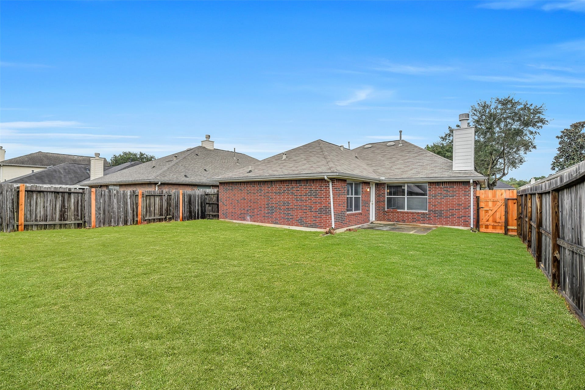 12115 Lucky Meadow Dr, Tomball, TX 77375 Spacious backyard offering plenty of room for gardening, outdoor activities