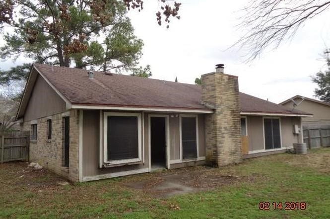 10603 Village Trail Drive, Houston, TX 77065 Spacious backyard, and large windows offering plenty of natural light.