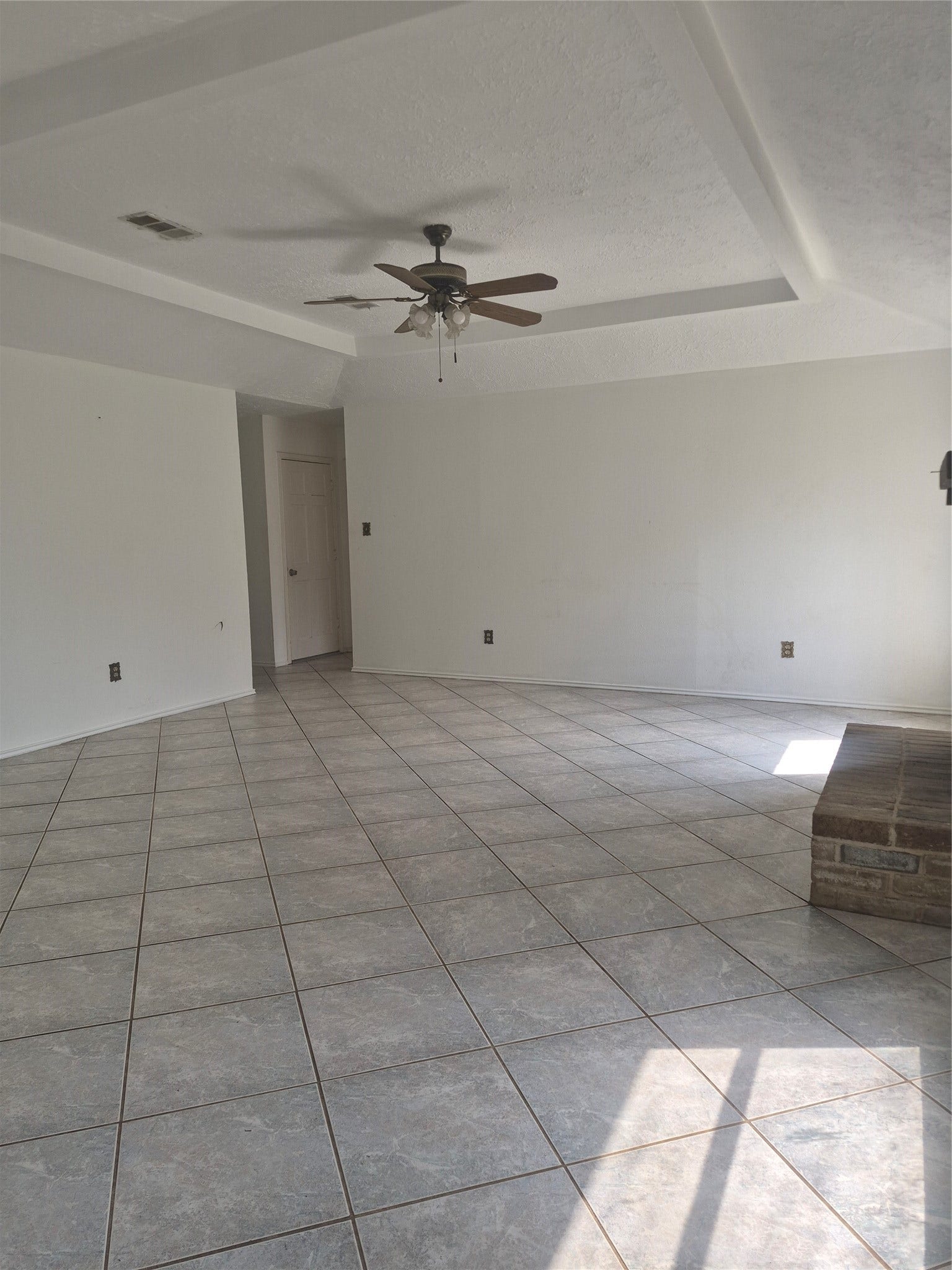 10603 Village Trail Drive, Houston, TX 77065 A ceiling fan, and ample natural light, perfect for comfortable gatherings.