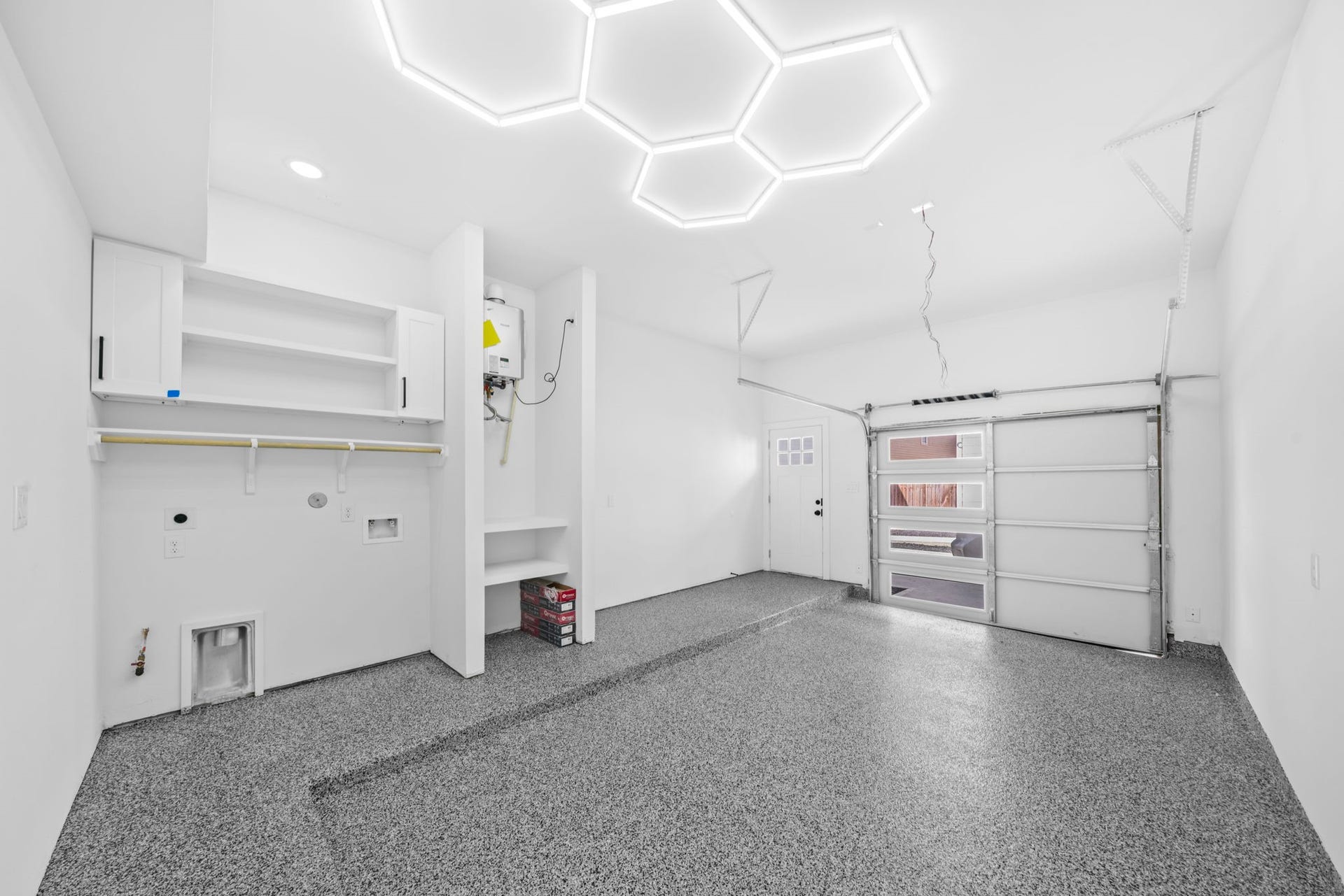 Epoxy finished garage floors and custom lighting. All laundry areas feature built in cabinets and shelves.