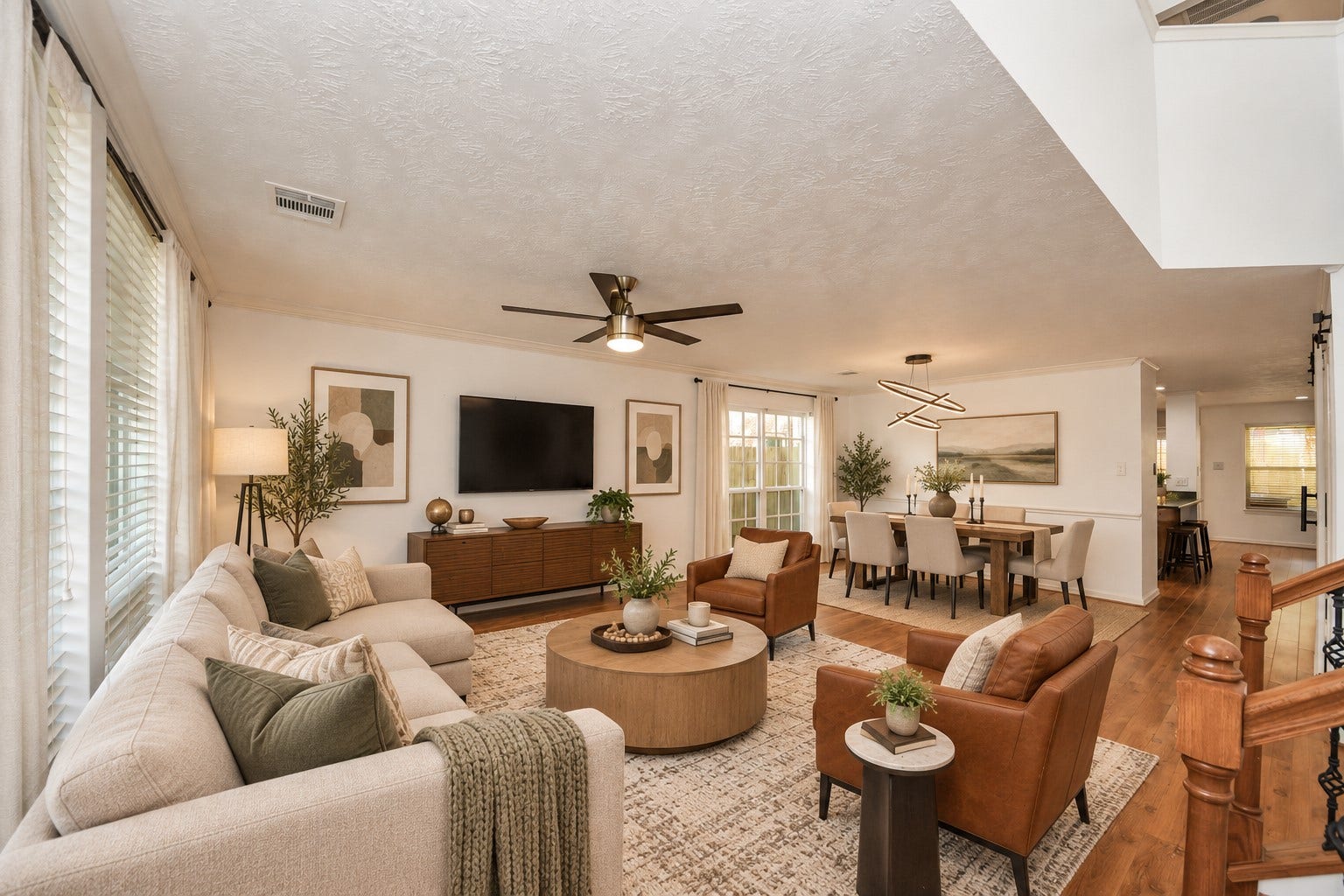 15007 Moss Boulder Court, Houston, TX 77084 Virtually staged main living area with large windows and seamless access to the dining area.