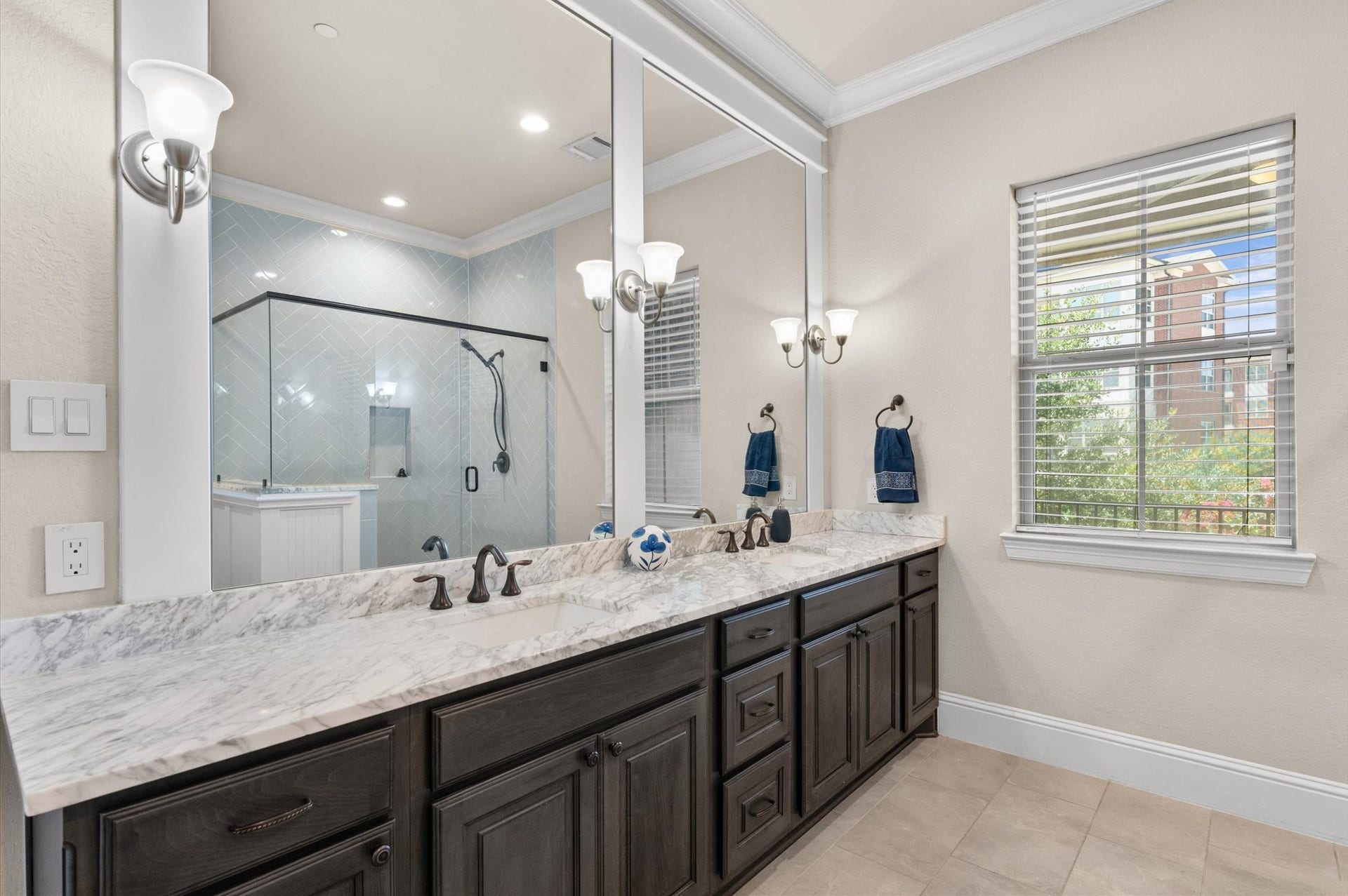 Spacious primary bathroom featuring a dual vanity sink.