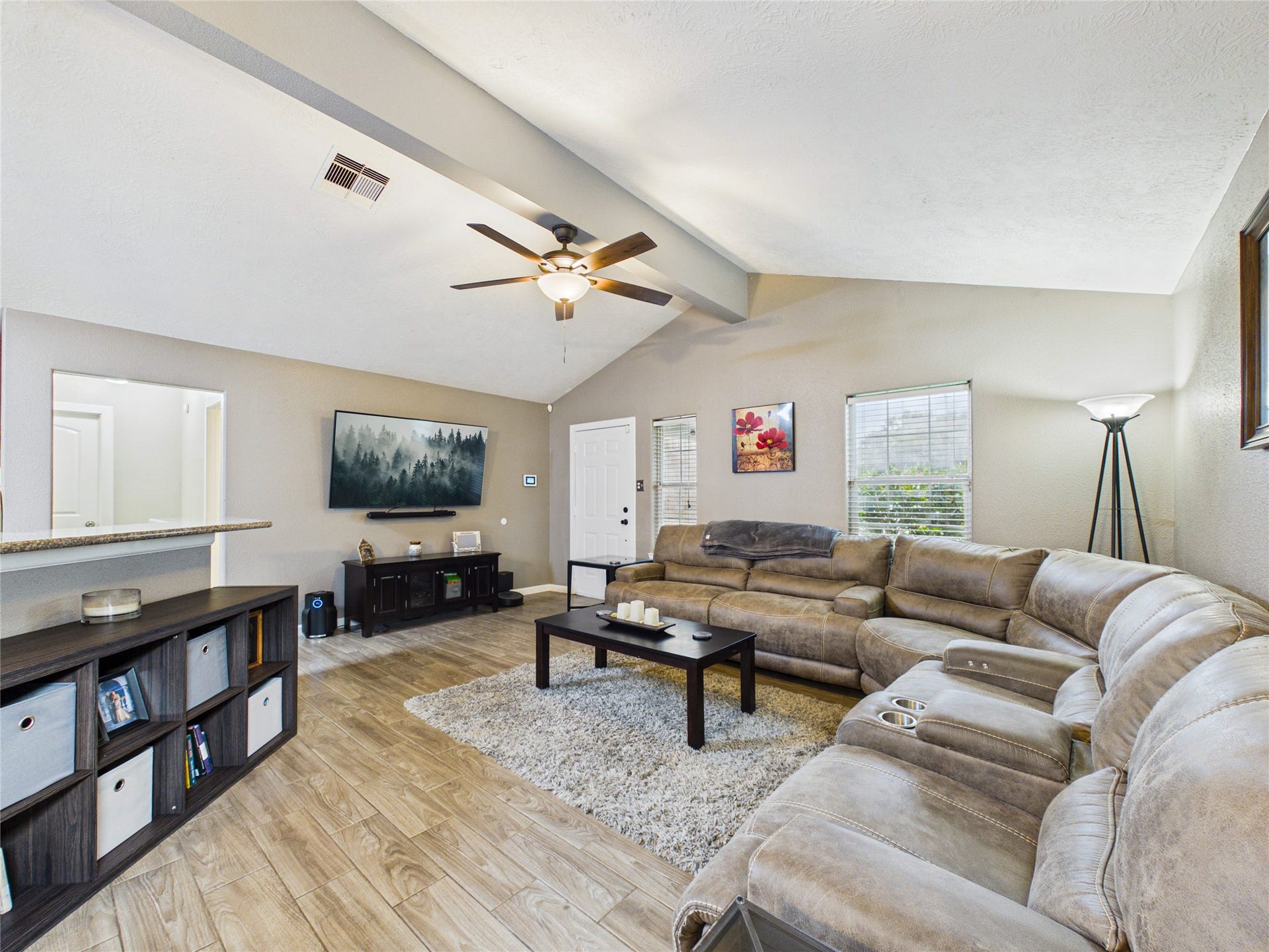 9022 Barracuda Drive, Texas City, TX 77591 Spacious living room with vaulted ceiling. A view of the front entrance of this well-maintained home.