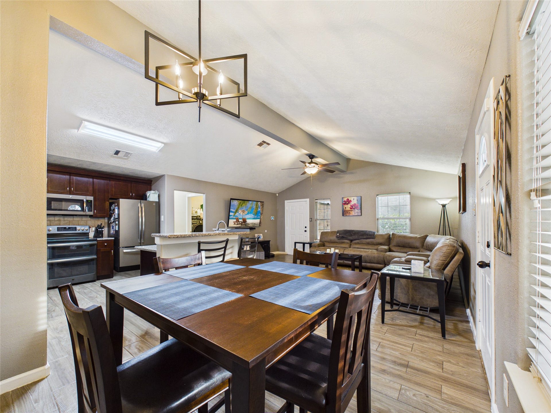 9022 Barracuda Drive, Texas City, TX 77591 Open-concept dining, kitchen, and living area creates an inviting space perfect for family gatherings and entertaining.
