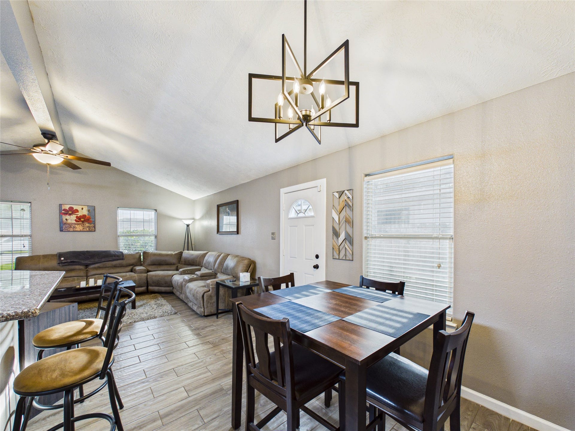 9022 Barracuda Drive, Texas City, TX 77591 Bright and inviting open-concept living area combo showing off the stylish dining space and modern light fixtures.