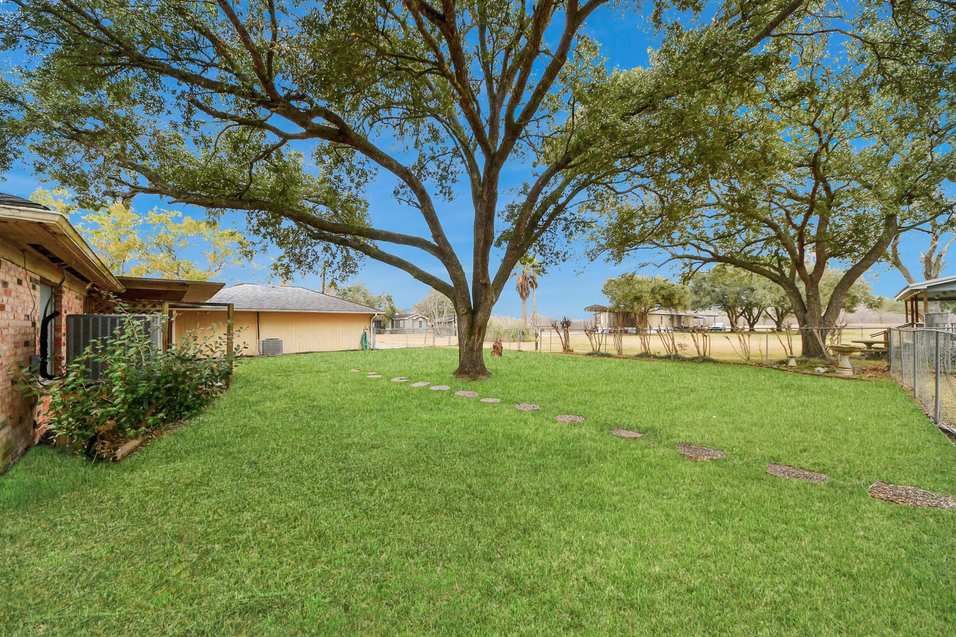 17115 County Road 831, Pearland, TX 77584 View of the fenced in backyard and the 3 car garage