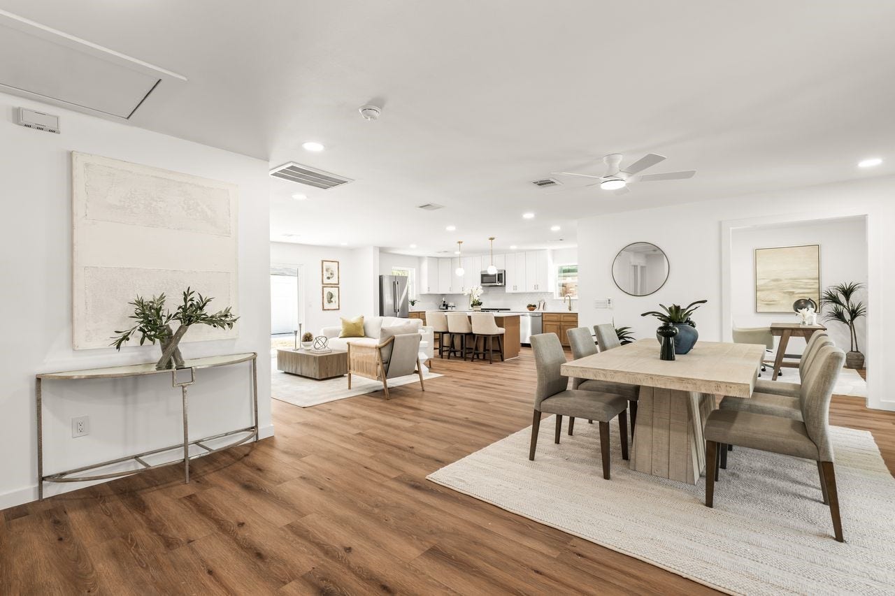 5207 Hummingbird Street, Houston, TX 77035 Bright open-concept layout connecting the dinning, living and kitchen areas with luxury vinyl plank flooring and recessed lighting