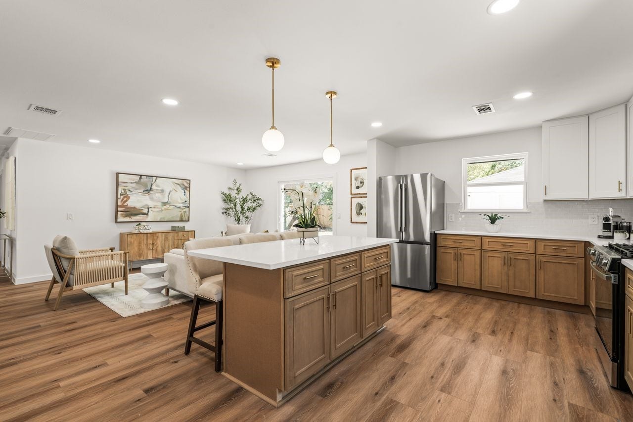 5207 Hummingbird Street, Houston, TX 77035 oversized quartz island with seating creates the perfect centerpiece for everyday living and entertaining