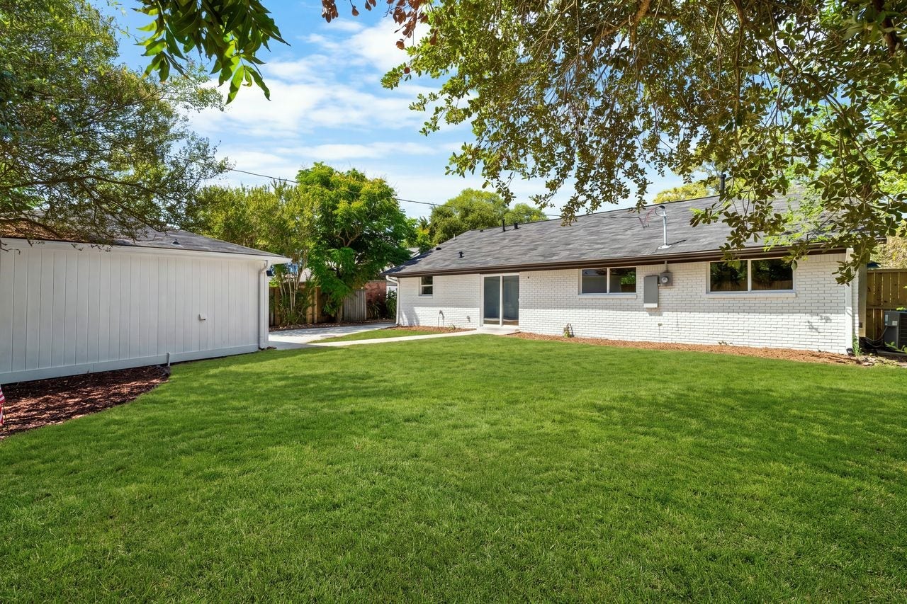 5207 Hummingbird Street, Houston, TX 77035 Fully fenced backyard with room to relax, play or create an outdoor entertaining area