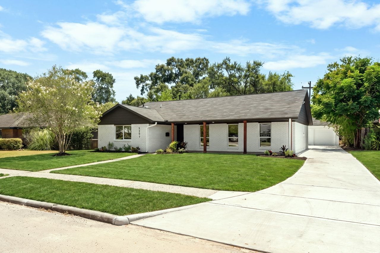 5207 Hummingbird Street, Houston, TX 77035 Beautifully updated single-story home with fresh landscaping modern painted-brick exterior and long driveway garage