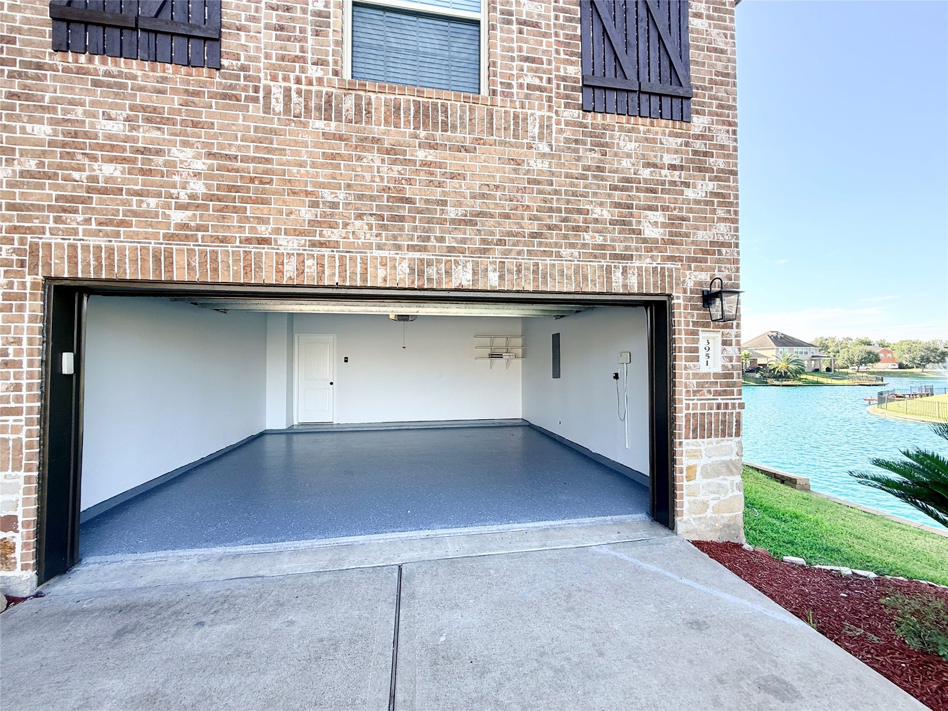 3951 Amalfi Shores Court, Missouri City, TX 77459 lakefront home w/ epoxy garage paint on the lake