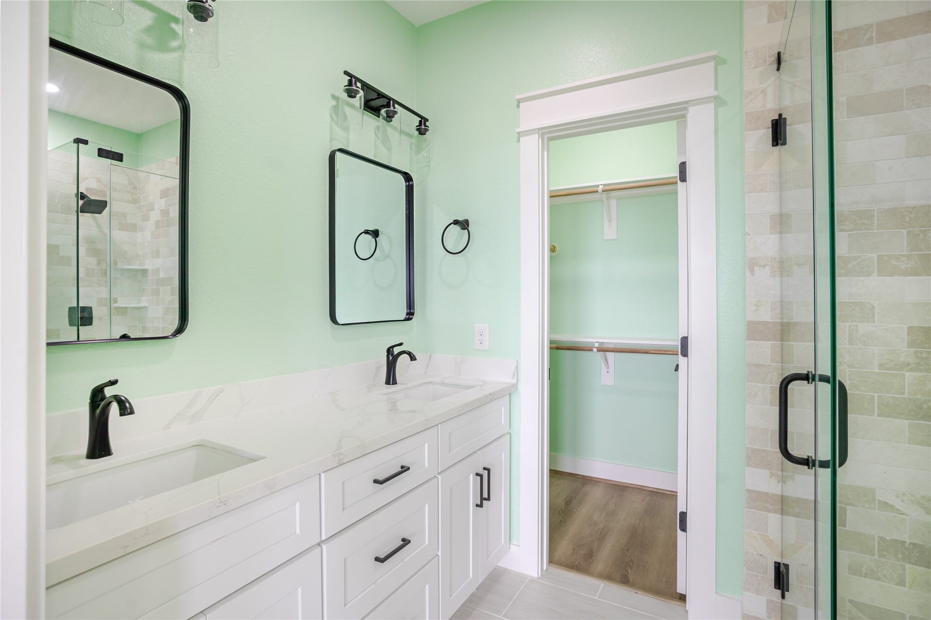 17518 Bristow Drive, Galveston, TX 77554 Primary bath with double sinks, large closet and expertly crafted glass-walk in shower!