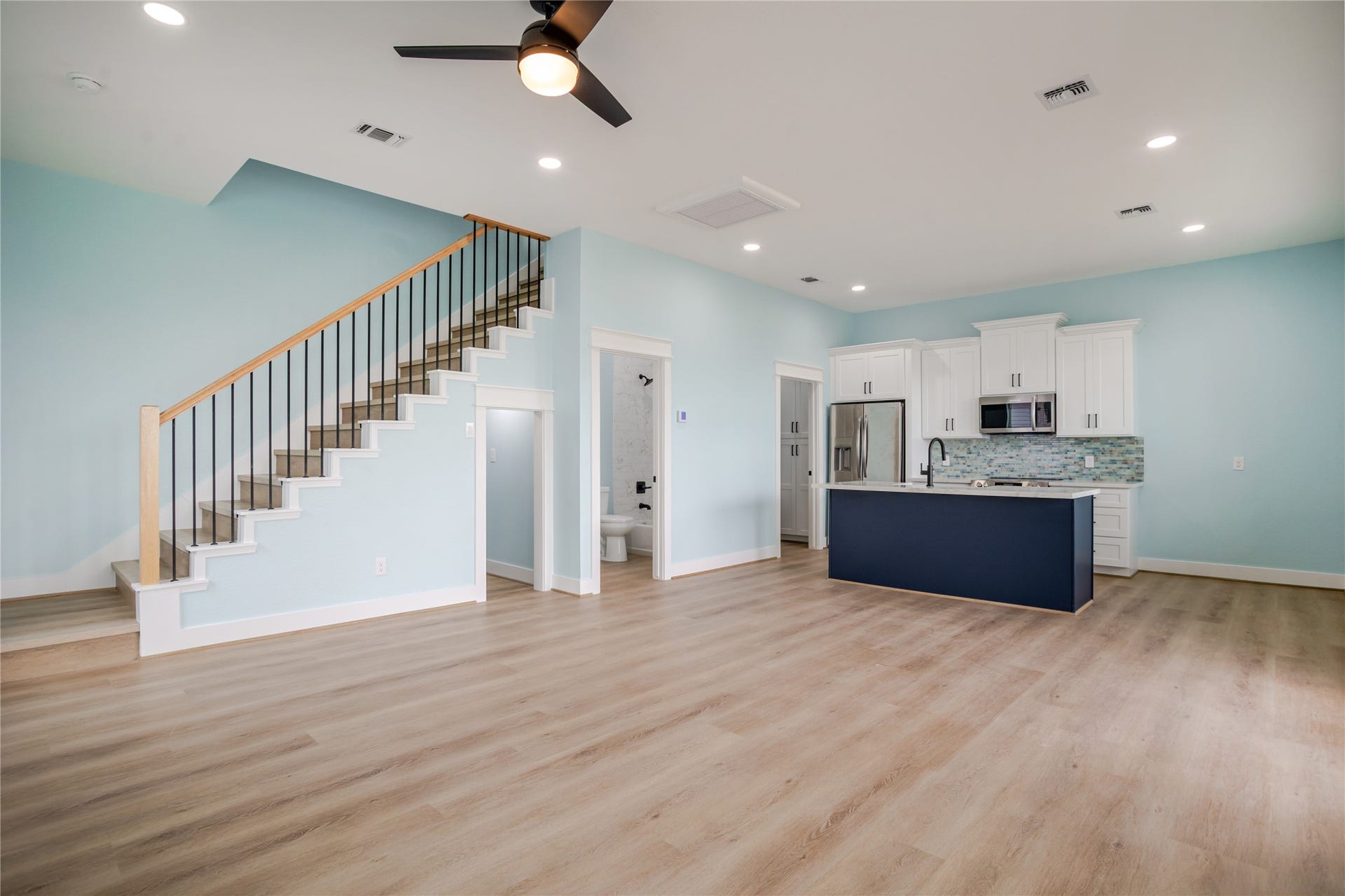 17518 Bristow Drive, Galveston, TX 77554 Downstairs living area, utility room, kitchn and den
