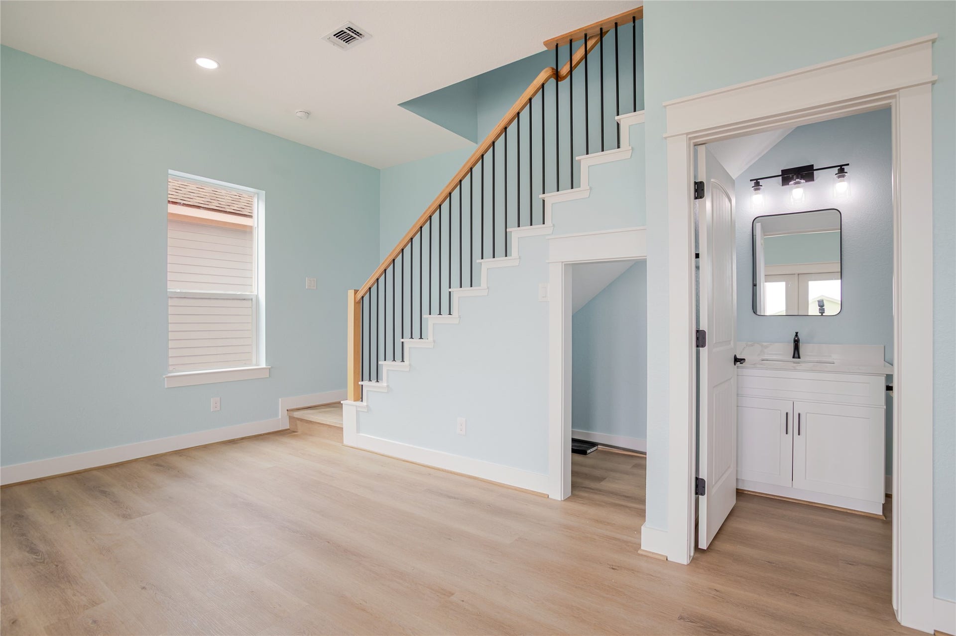 17518 Bristow Drive, Galveston, TX 77554 Beautiful trimmed out staircase leading to upstairs bedrooms. Notice the storage area under the stairs!