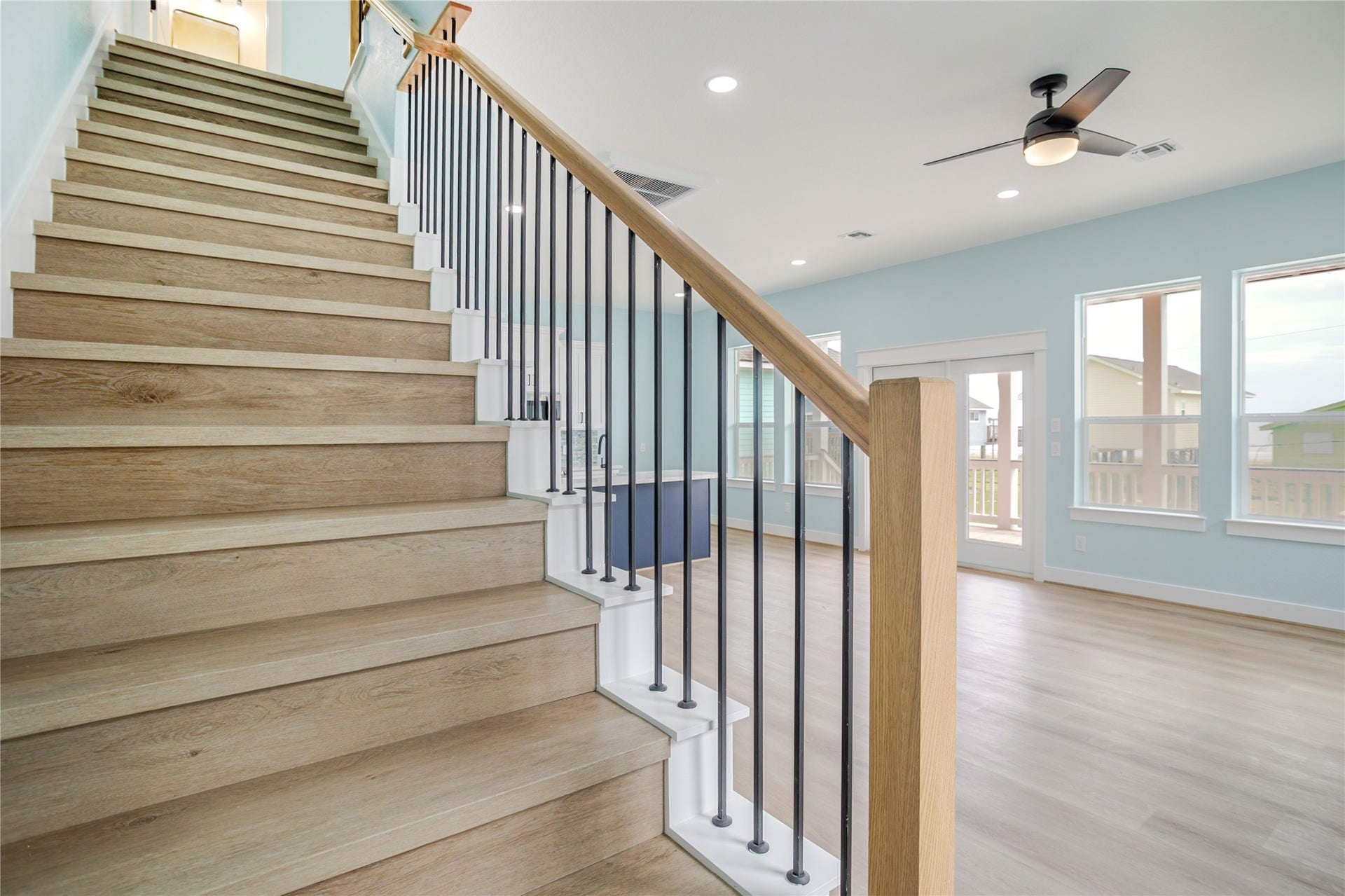 17518 Bristow Drive, Galveston, TX 77554 Rod iron meets wood! Beautiful staircase that is engineered to be functional yet a designer look to the home!