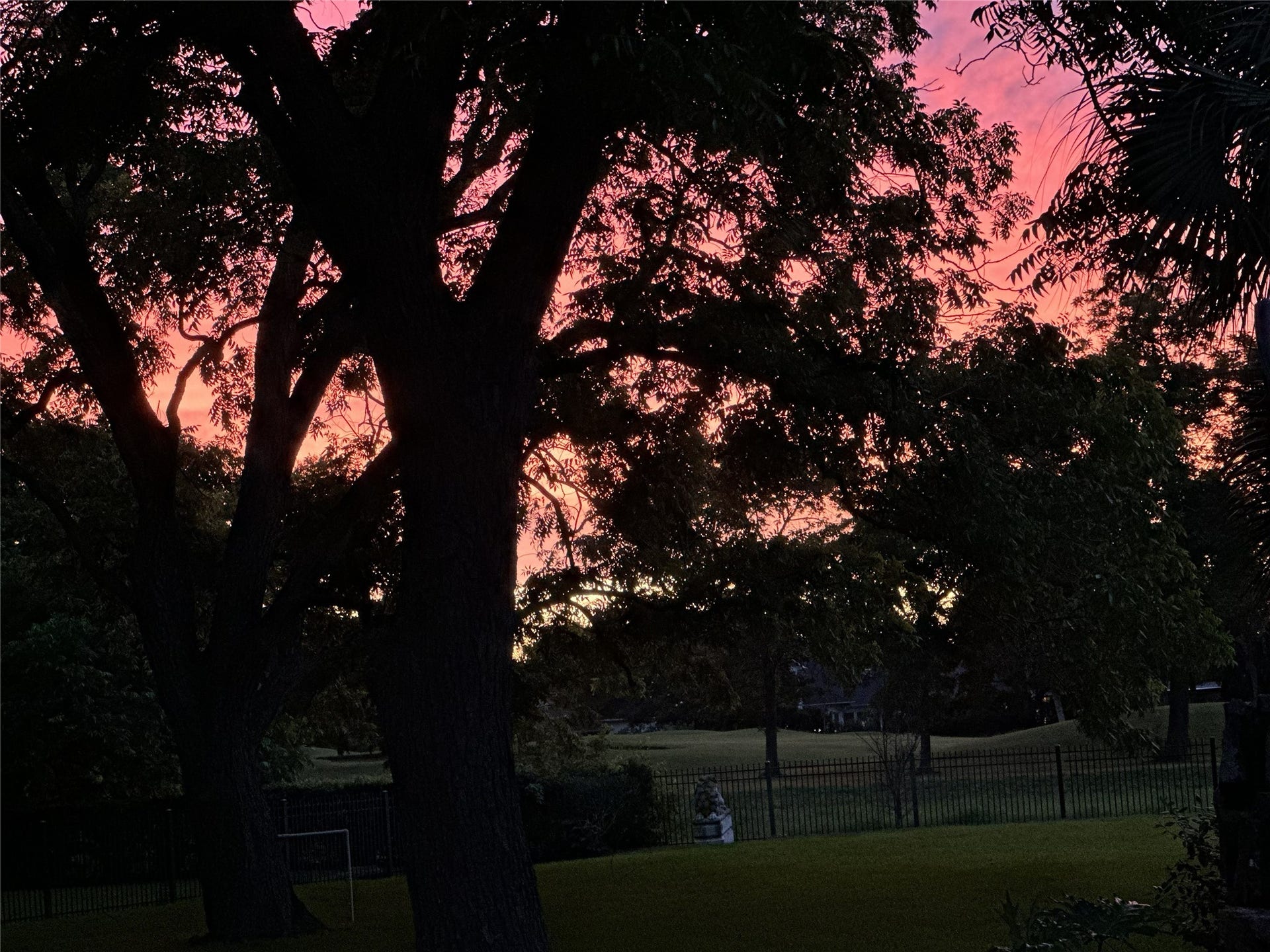 1830 Forest Gate Circle, Sugar Land, TX 77479 A sunset view from the backyard looking out to the golf course.