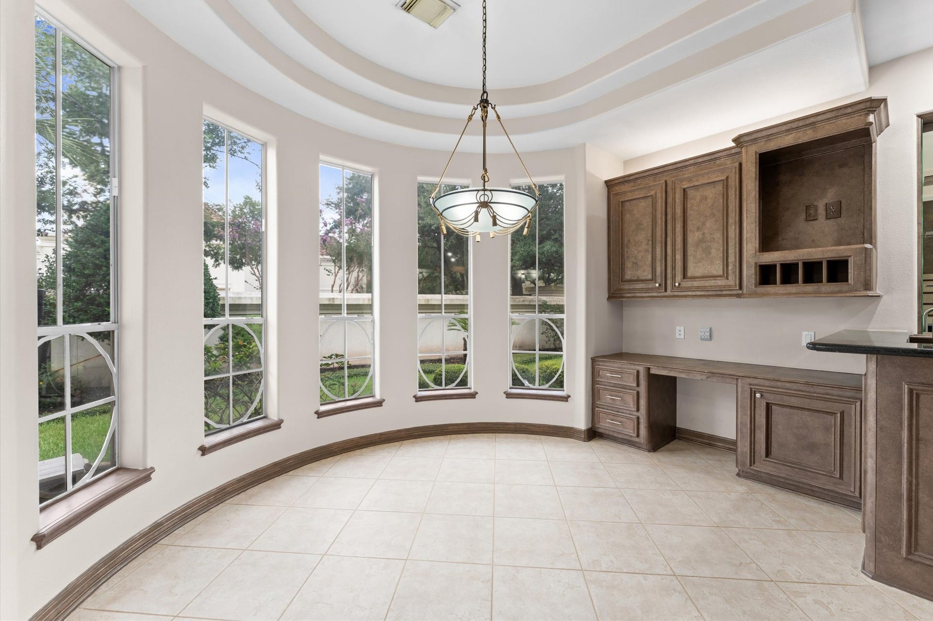 1830 Forest Gate Circle, Sugar Land, TX 77479 A view of the breakfast area and the custom windows with built-in desk.