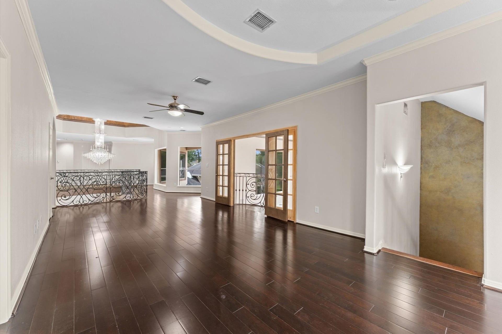 1830 Forest Gate Circle, Sugar Land, TX 77479 Another view of the grand room. The doorway on the right is a second stairway which leads down to the kitchen.