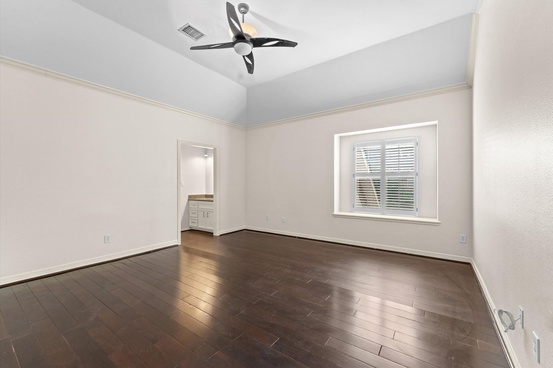 1830 Forest Gate Circle, Sugar Land, TX 77479 This bedroom has beautiful wood flooring. At the corner you see the sink into the bathroom area.