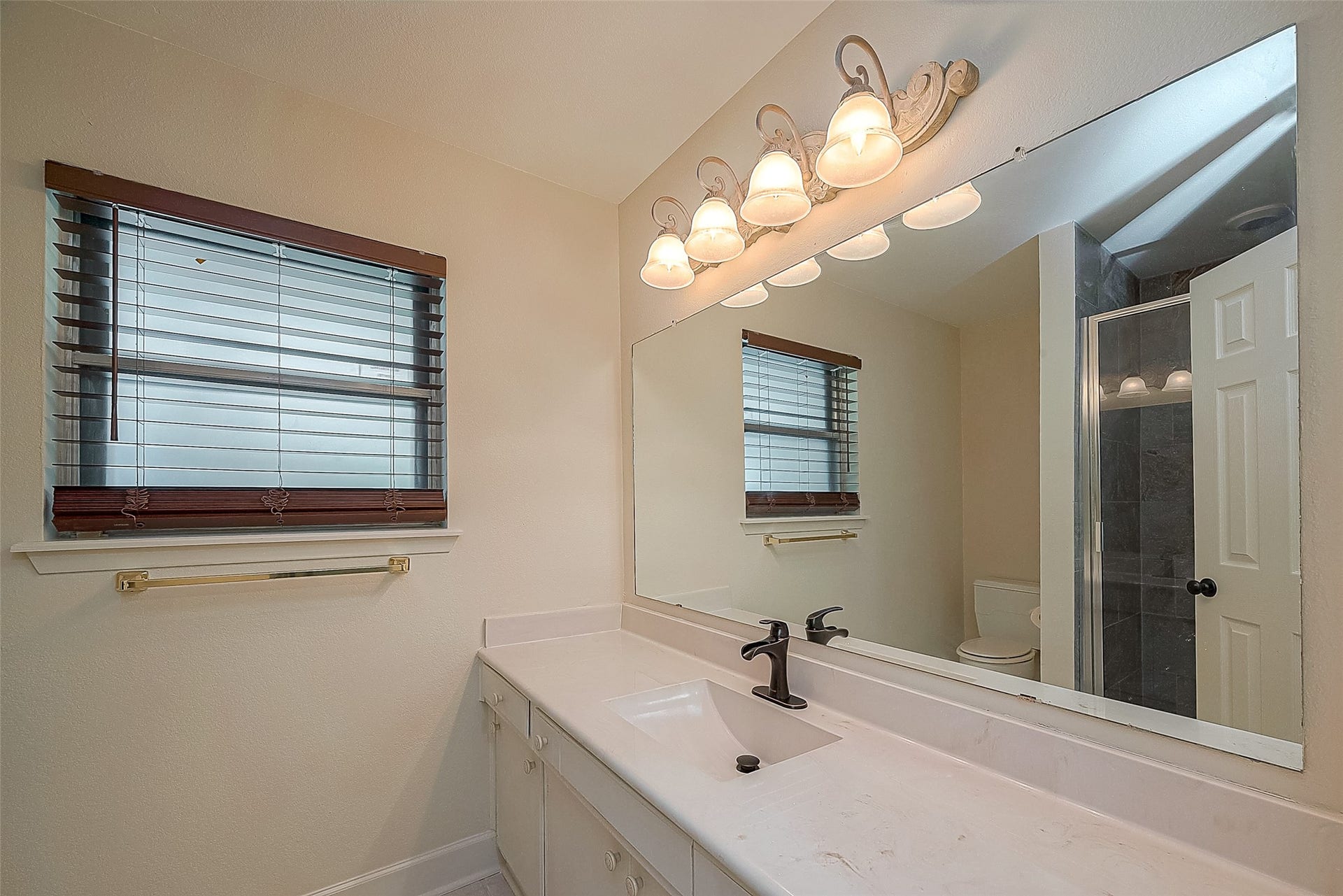 20 Champions Colony E, Houston, TX 77069 The primary bathroom features a separate shower, providing added convenience and a modern touch.