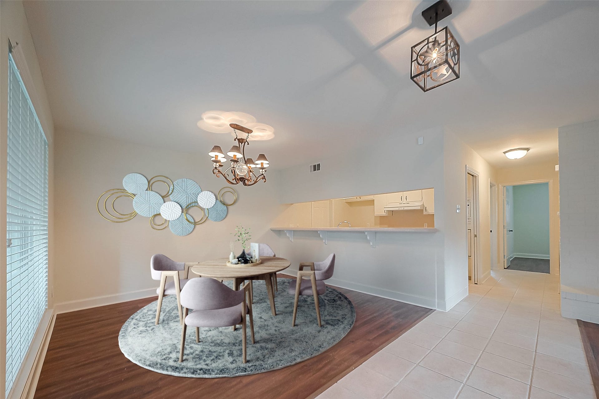 20 Champions Colony E, Houston, TX 77069 The dining room is bathed in natural light streaming through expansive windows, casting a gentle glow and providing delightful vistas of the surrounding outdoors. *virtually staged