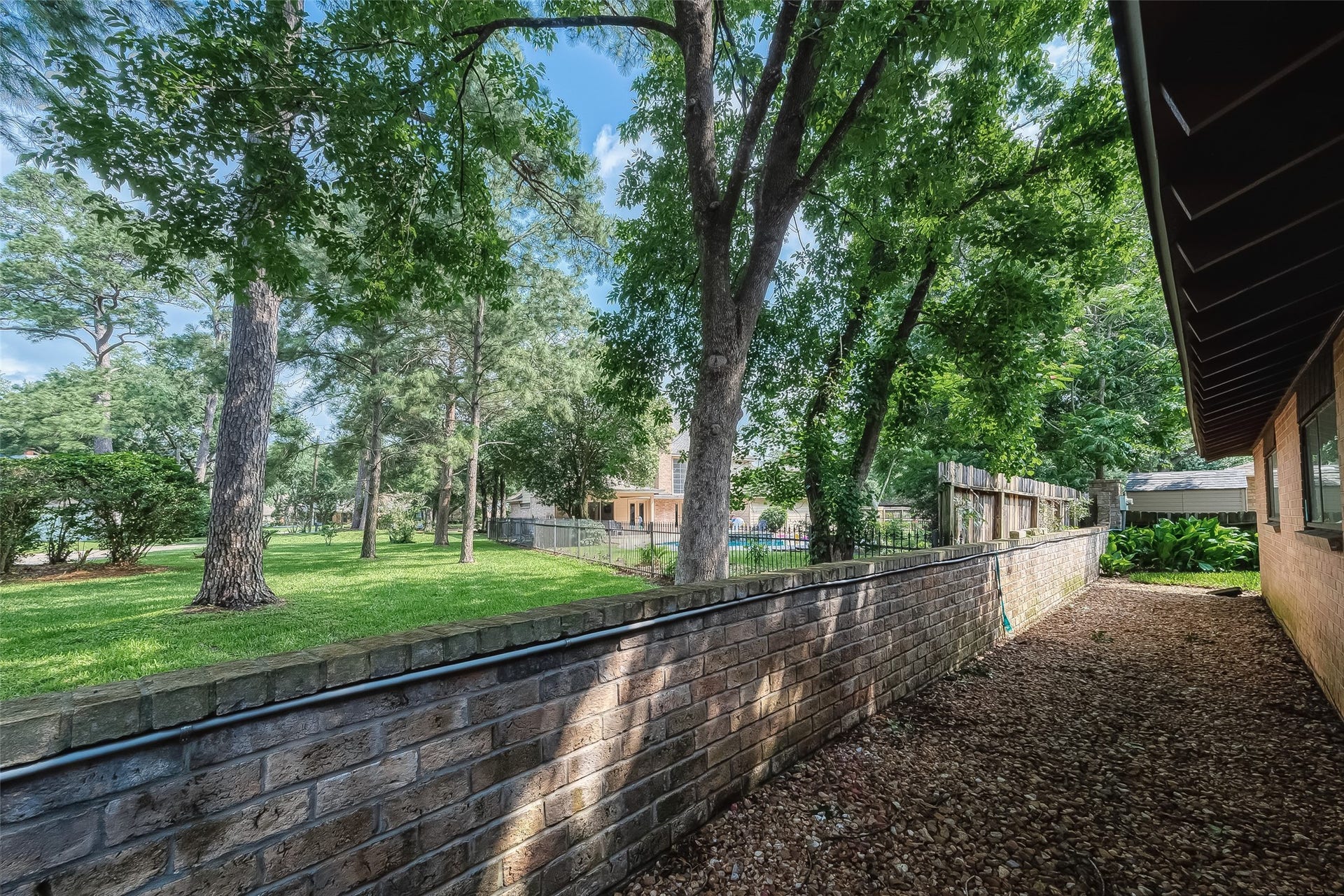 20 Champions Colony E, Houston, TX 77069 Brick fences offer sound insulation properties, reducing noise from nearby streets, neighbors, or other sources. This can create a quieter and more peaceful environment in your backyard, allowing you to relax and enjoy outdoor activities without disturbance.