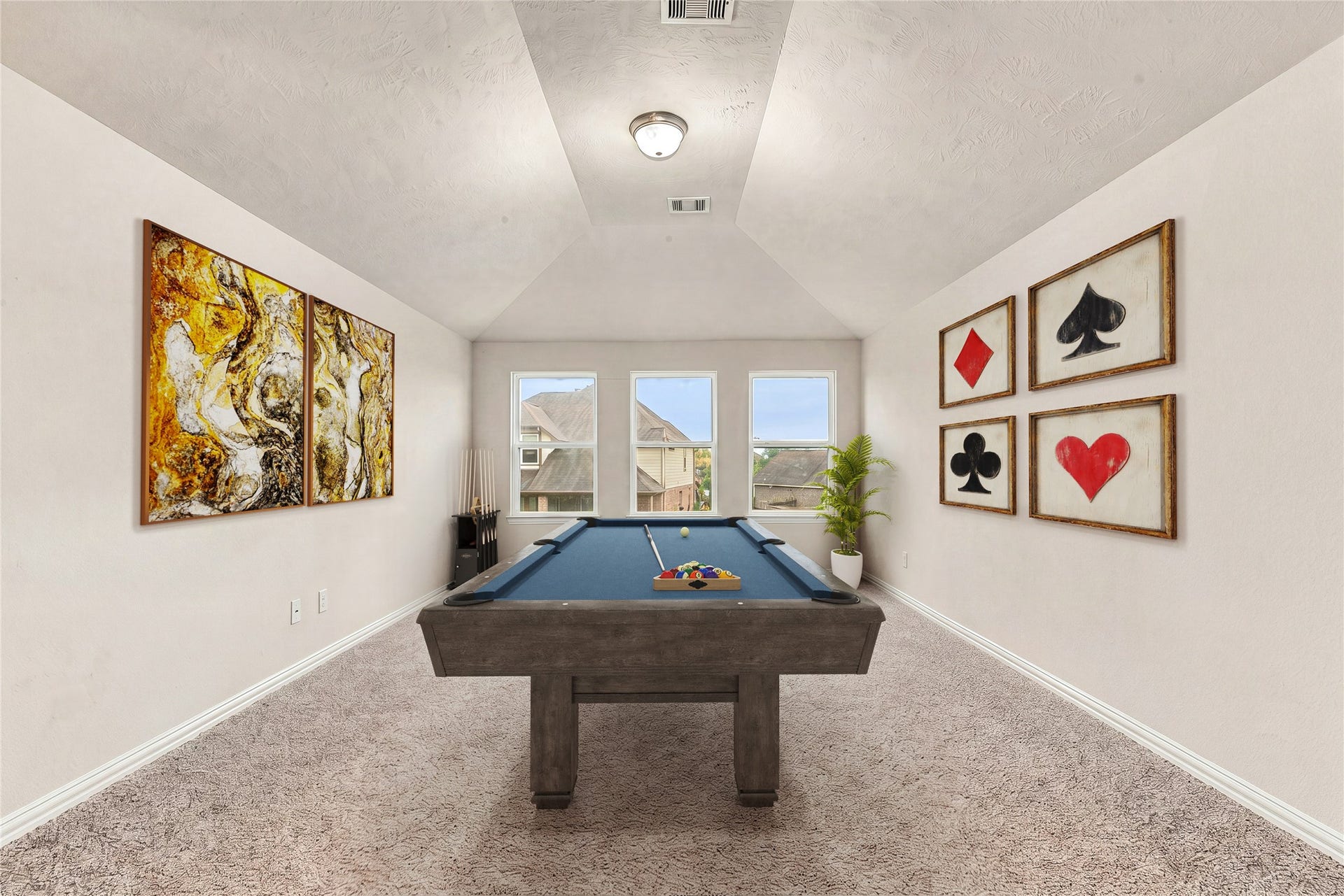7018 Pearl Terrace Lane, Richmond, TX 77469 Spacious upstairs game room with a vaulted ceiling, neutral carpet, and a bay of windows, a versatile flex space for recreation or play. *Virtually Staged