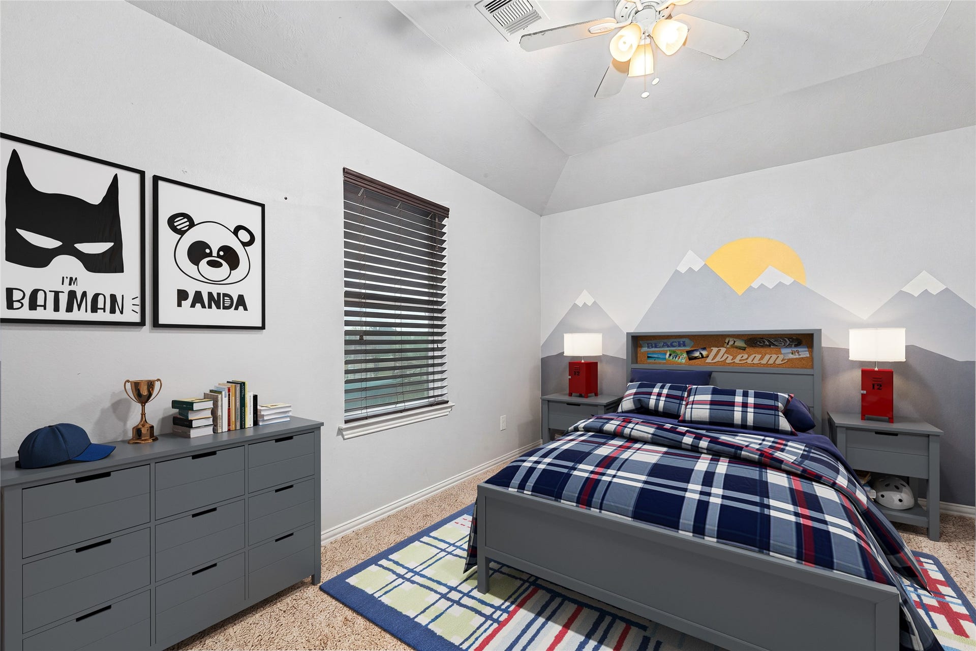 7018 Pearl Terrace Lane, Richmond, TX 77469 Spacious secondary bedroom with a vaulted ceiling, large window, and a fun painted accent wall, perfect for a kids' room or guest space. *Virtually Staged