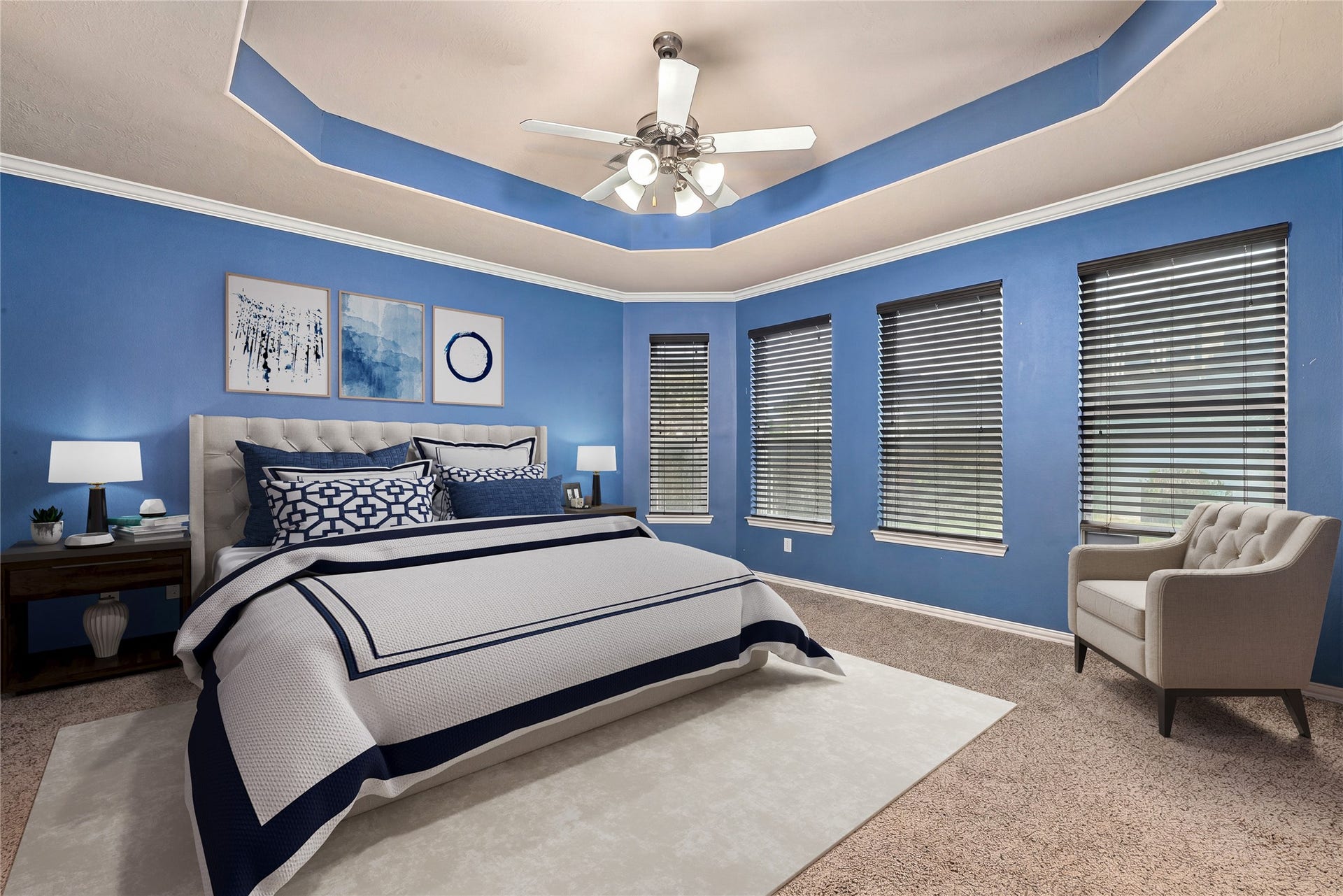 7018 Pearl Terrace Lane, Richmond, TX 77469 Generously sized primary suite featuring a coffered tray ceiling, crown molding, and a wall of windows in a sunny corner layout. *Virtually Staged